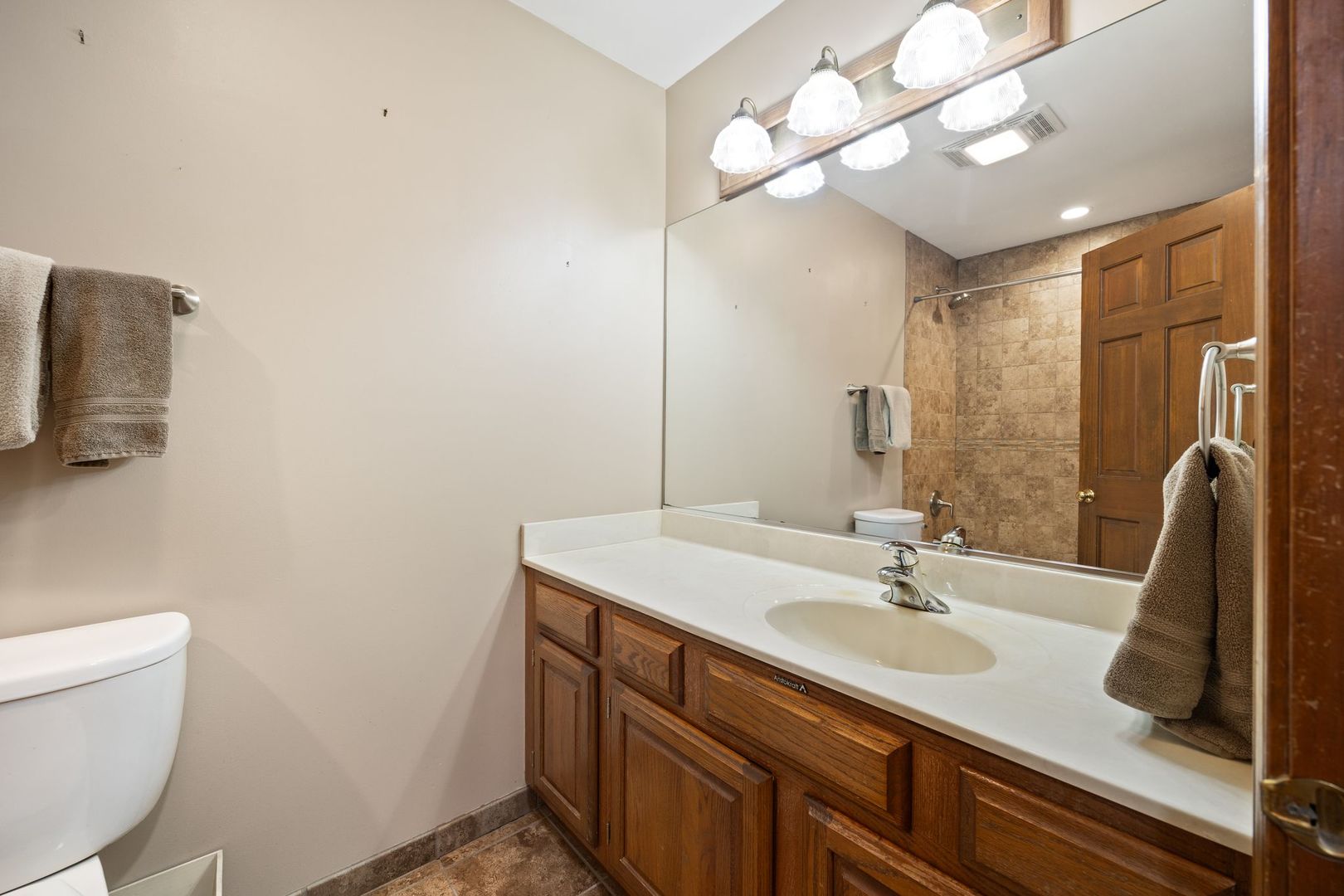 727 Old Hunt Road Fox River Grove, IL 60021 - Photo 12 of 26 a bathroom with a sink a toilet and a mirror