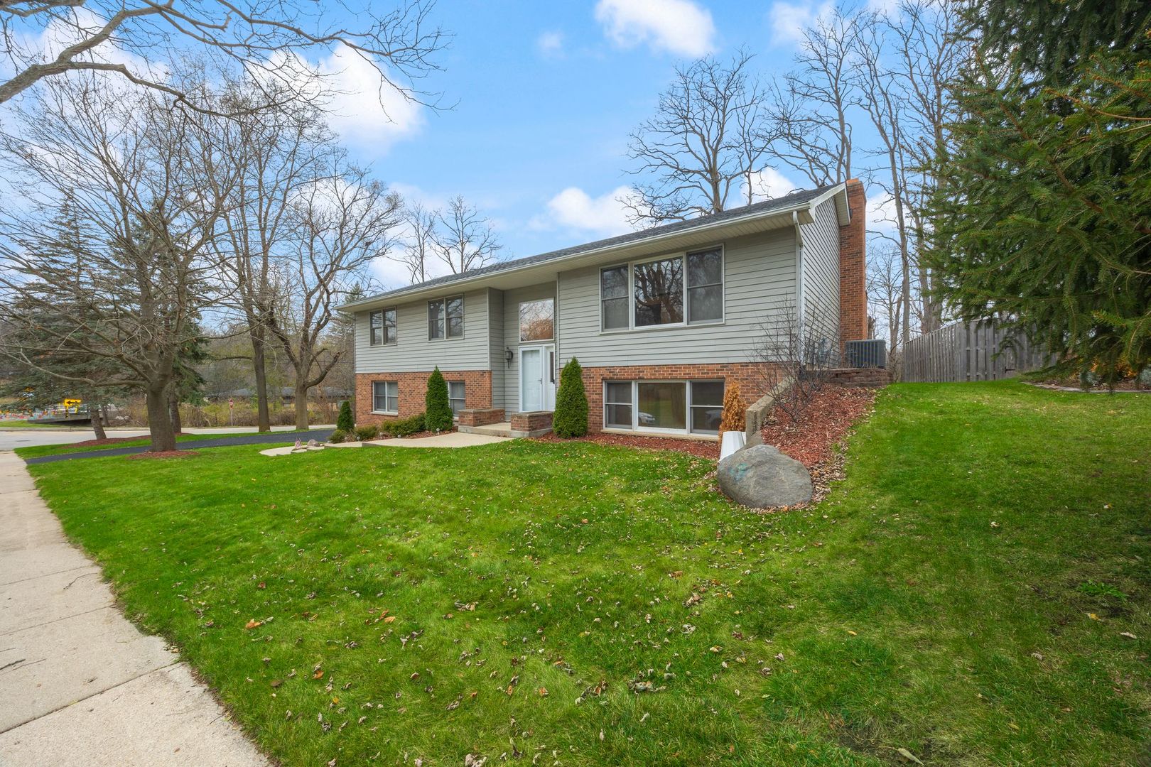 727 Old Hunt Road Fox River Grove, IL 60021 - Photo 2 of 26 a front view of house with yard and green space