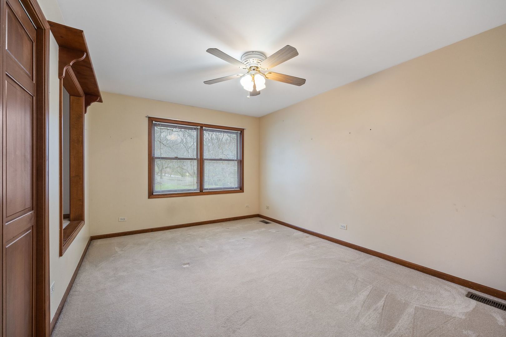 727 Old Hunt Road Fox River Grove, IL 60021 - Photo 10 of 26 an empty room with windows and fan