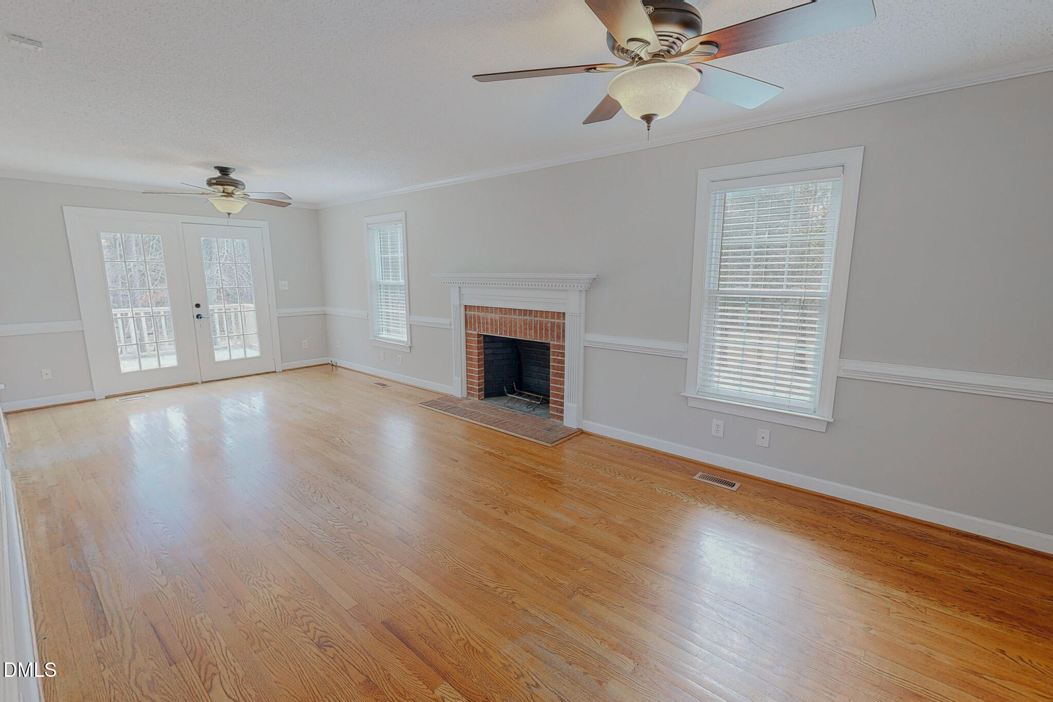 202 Equestrian Chase Rougemont, NC 27572 - Photo 11 of 54 an empty room with wooden floor fan and windows