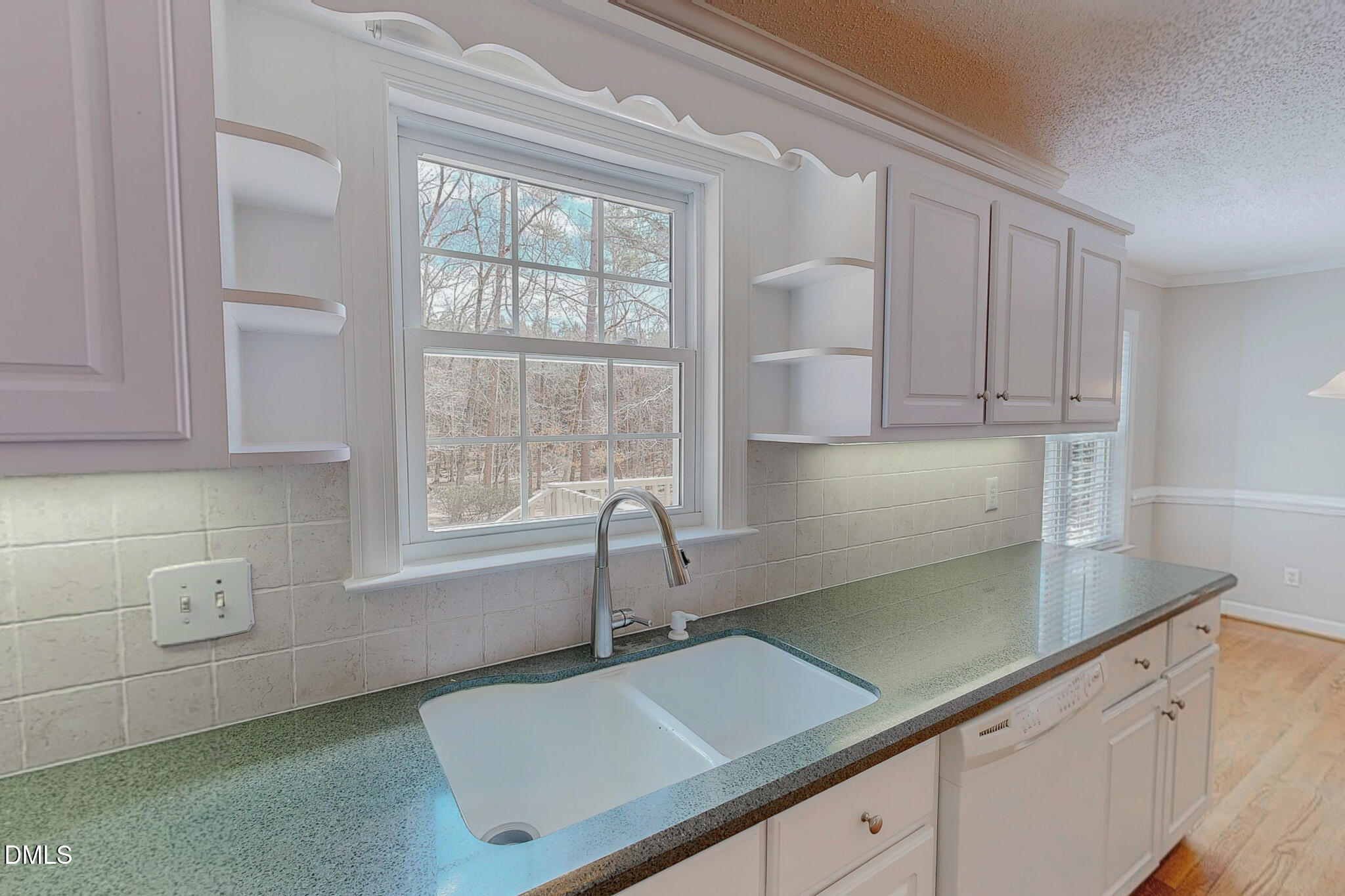 202 Equestrian Chase Rougemont, NC 27572 - Photo 13 of 54 a kitchen with a sink cabinets and window