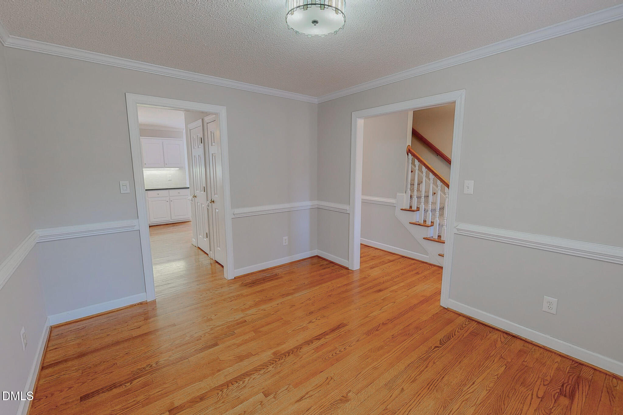 202 Equestrian Chase Rougemont, NC 27572 - Photo 16 of 54 a view of empty room with wooden floor and fan