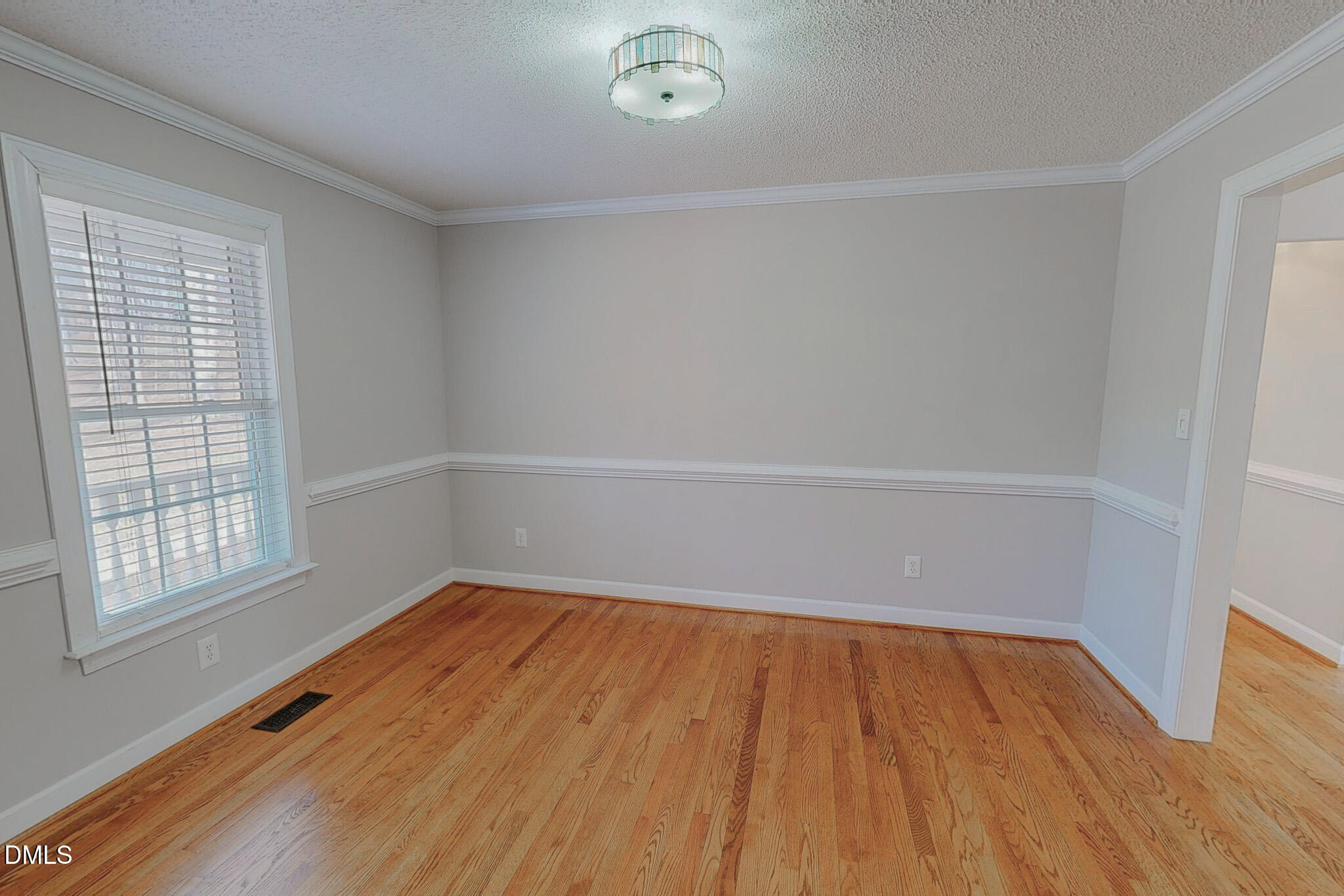 202 Equestrian Chase Rougemont, NC 27572 - Photo 17 of 54 wooden floor in an empty room with a window