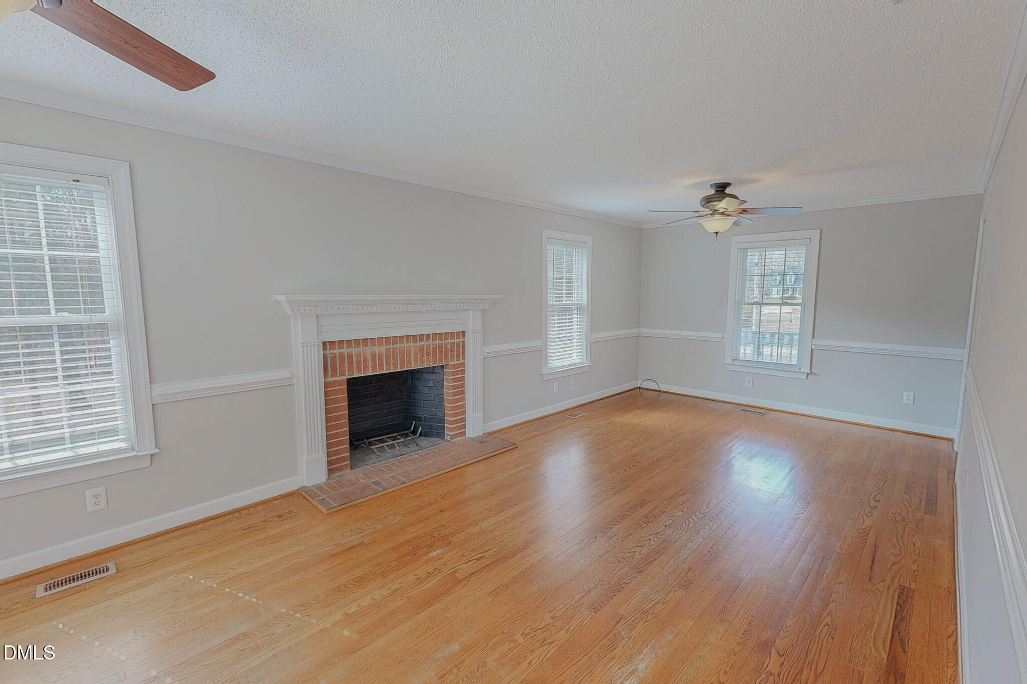 202 Equestrian Chase Rougemont, NC 27572 - Photo 2 of 54 a view of an empty room with wooden floor fireplace and a window