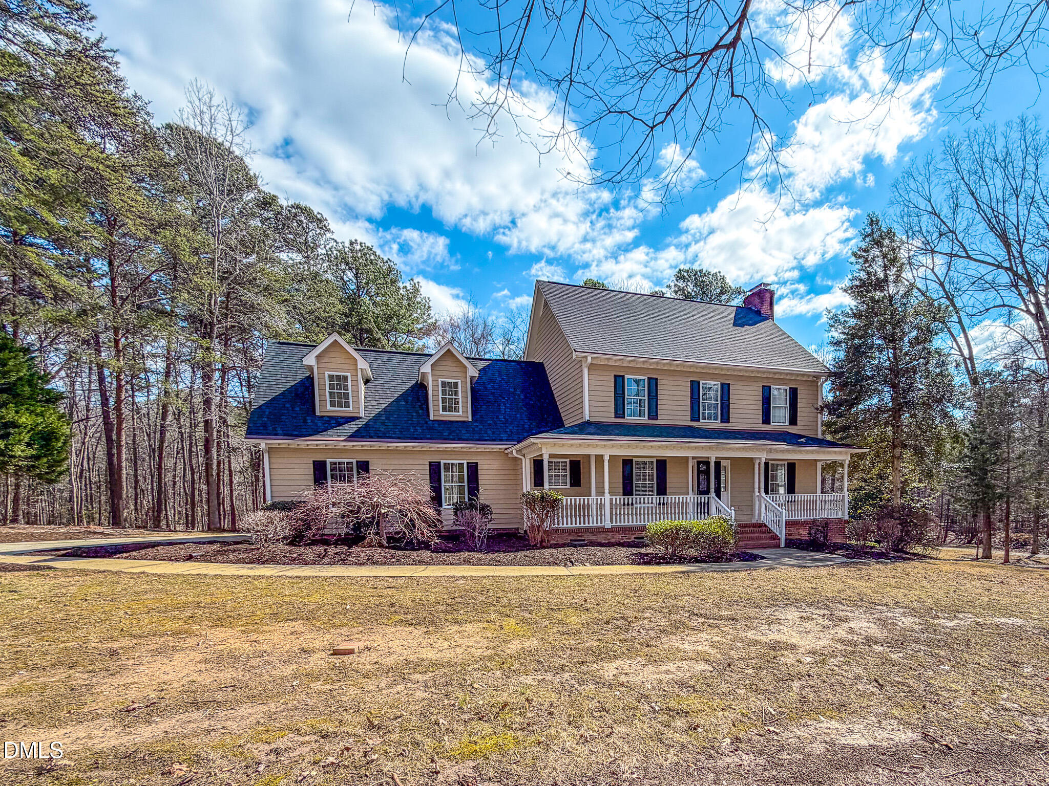 202 Equestrian Chase Rougemont, NC 27572 - Photo 28 of 54 a front view of a house with a yard covered with snow and trees