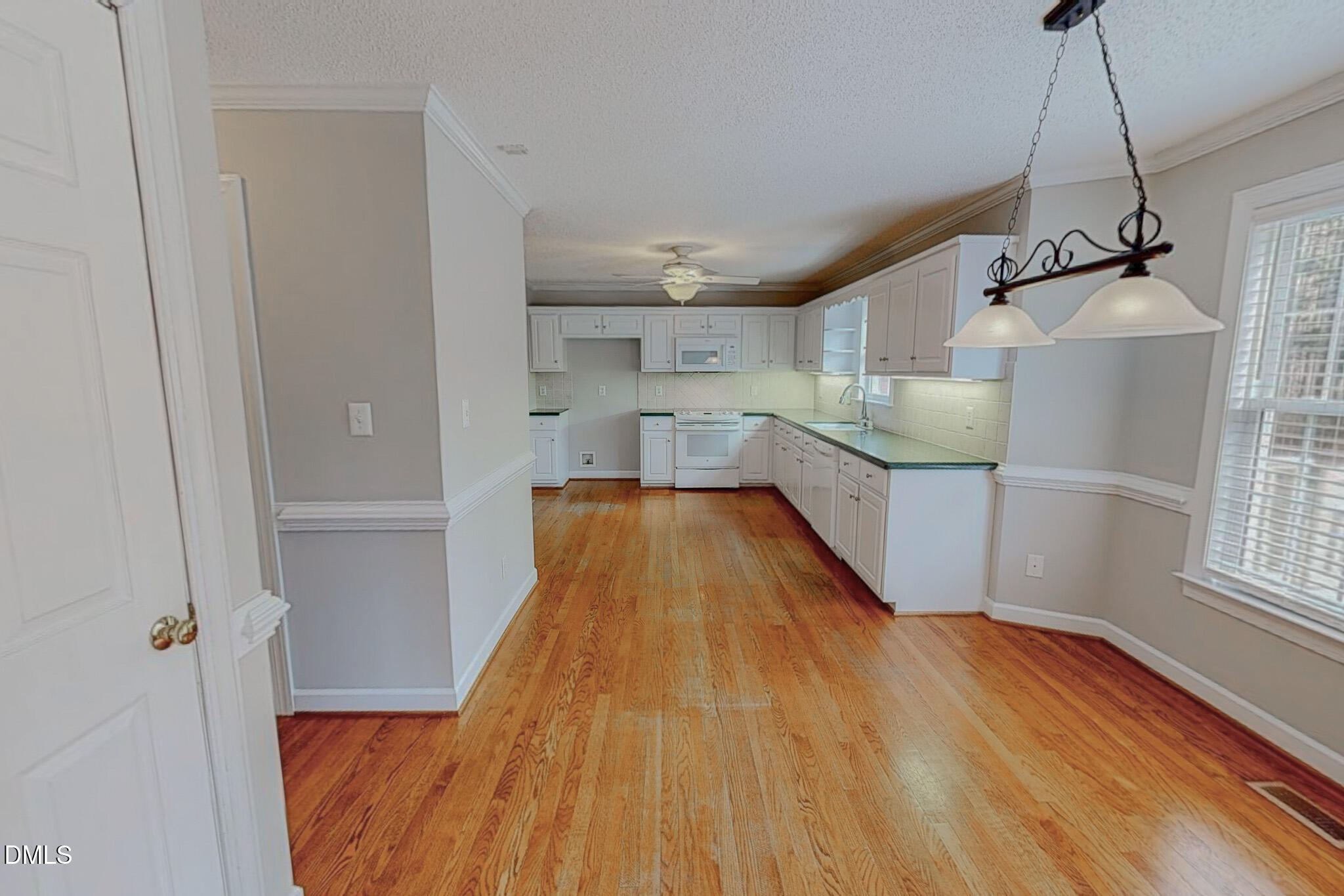 202 Equestrian Chase Rougemont, NC 27572 - Photo 3 of 54 a view of a kitchen with a sink and wooden floor