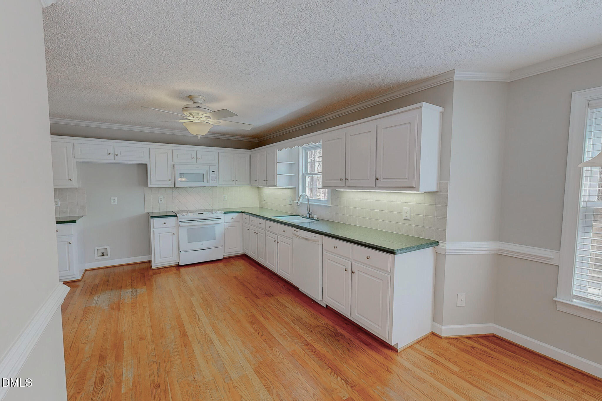 202 Equestrian Chase Rougemont, NC 27572 - Photo 48 of 54 a kitchen with granite countertop a sink stainless steel appliances and cabinets
