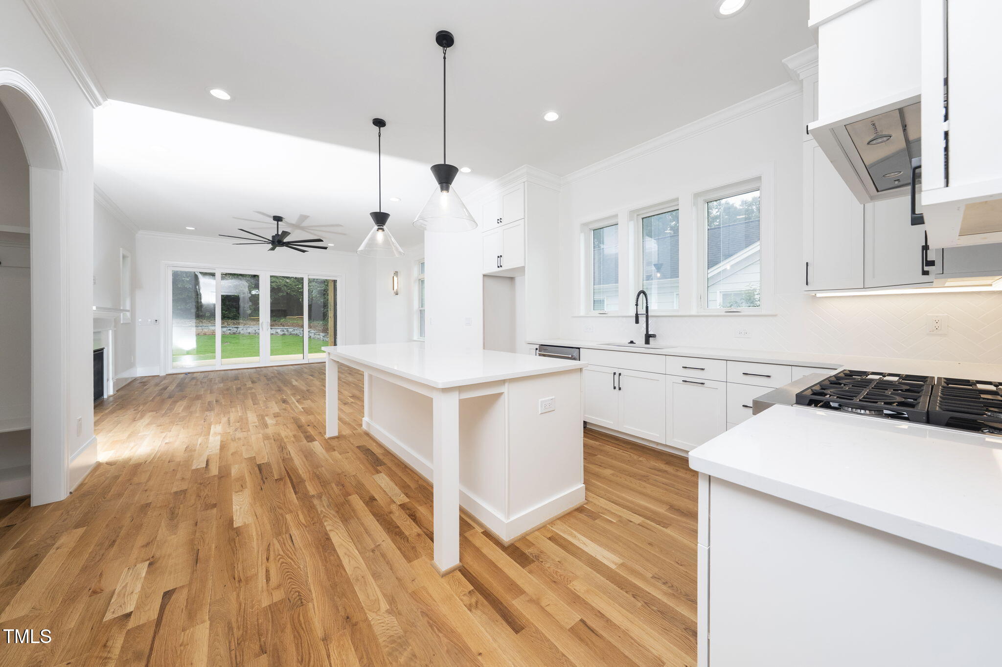 1330 Duplin Road Raleigh, NC 27607 - Photo 15 of 53 a large white kitchen with a stove a sink dishwasher and a oven with cabinets
