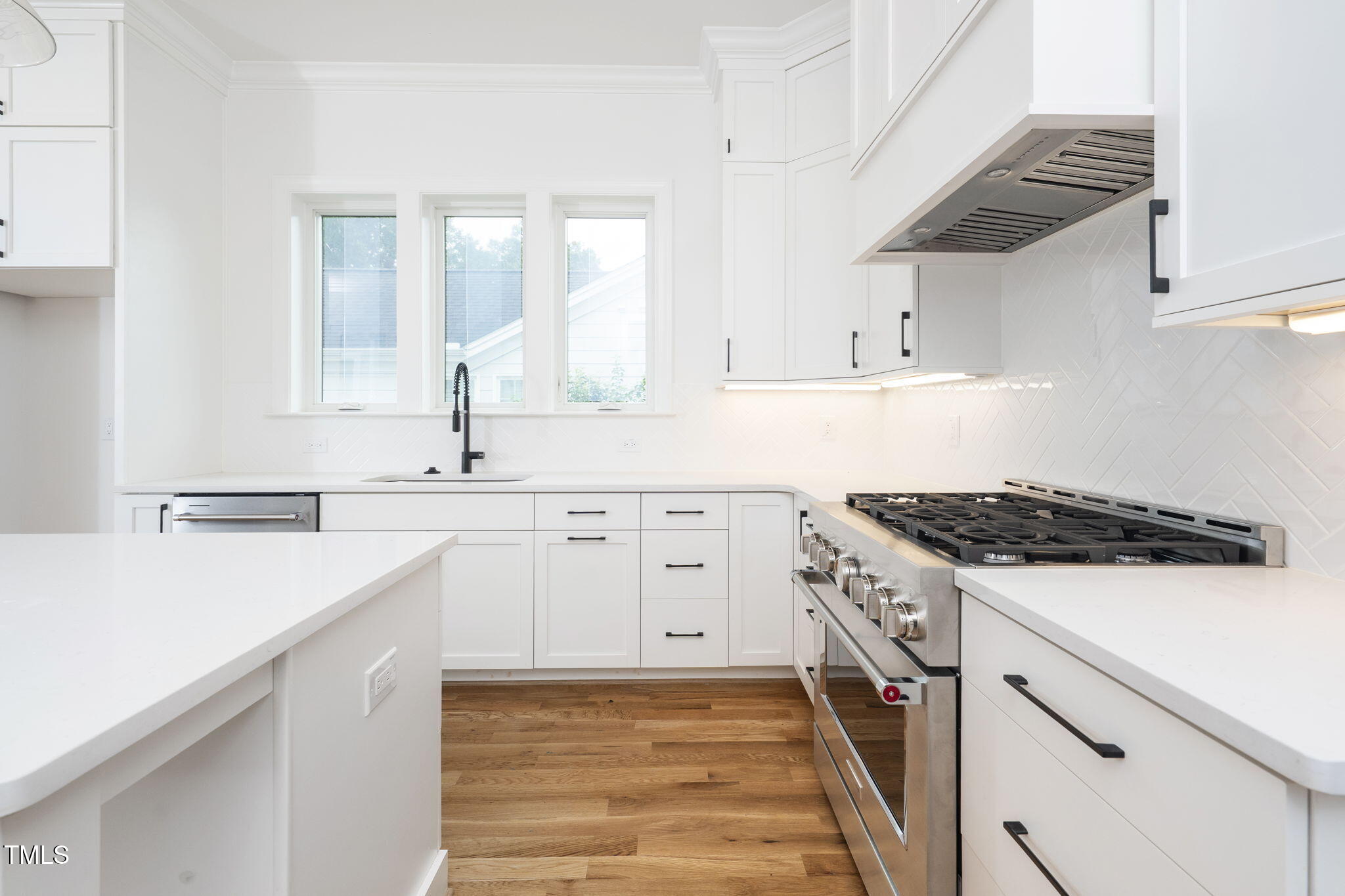 1330 Duplin Road Raleigh, NC 27607 - Photo 17 of 53 a kitchen with cabinets appliances a sink and a counter top