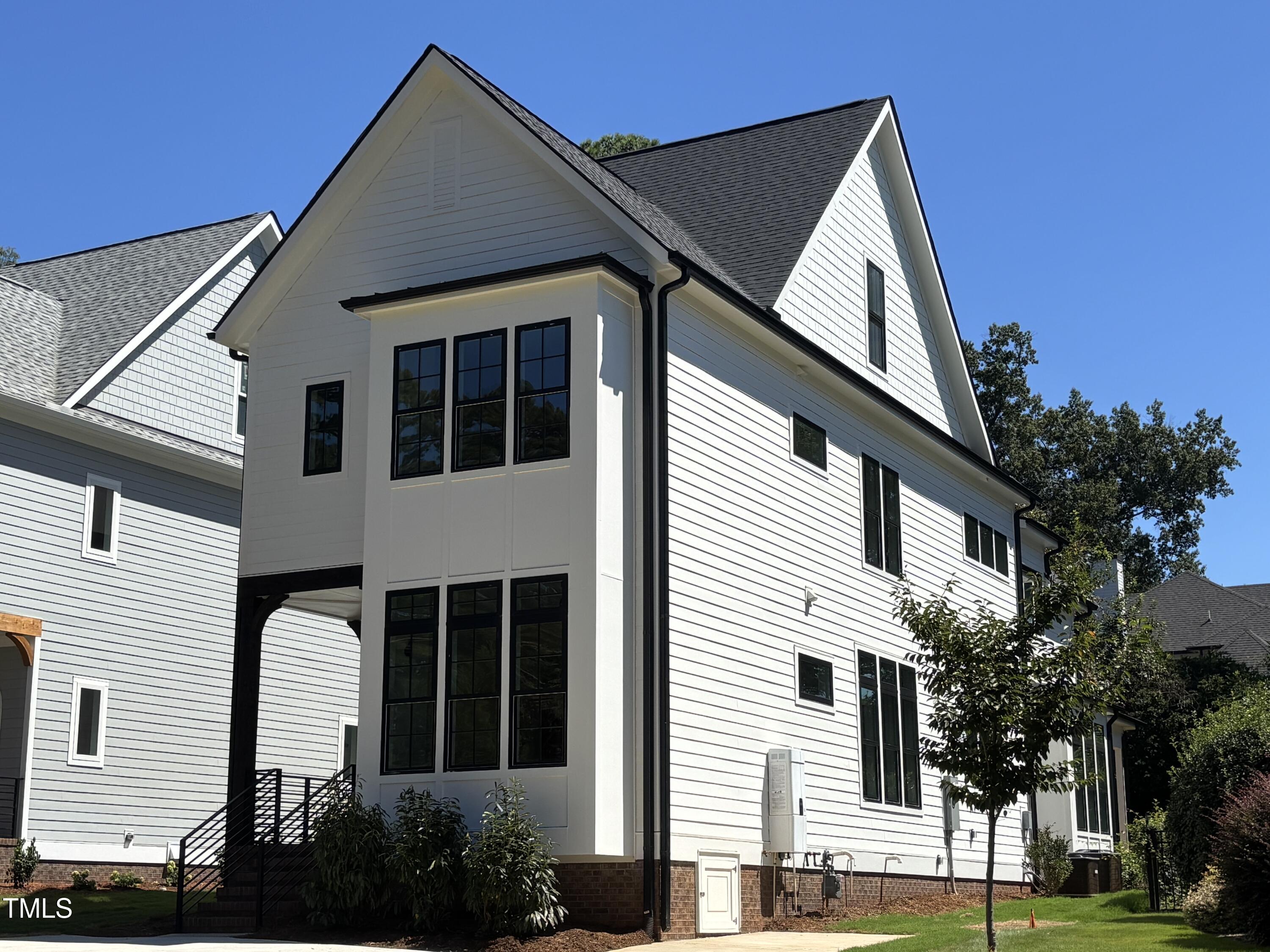 1330 Duplin Road Raleigh, NC 27607 - Photo 2 of 53 a front view of a house with a garden