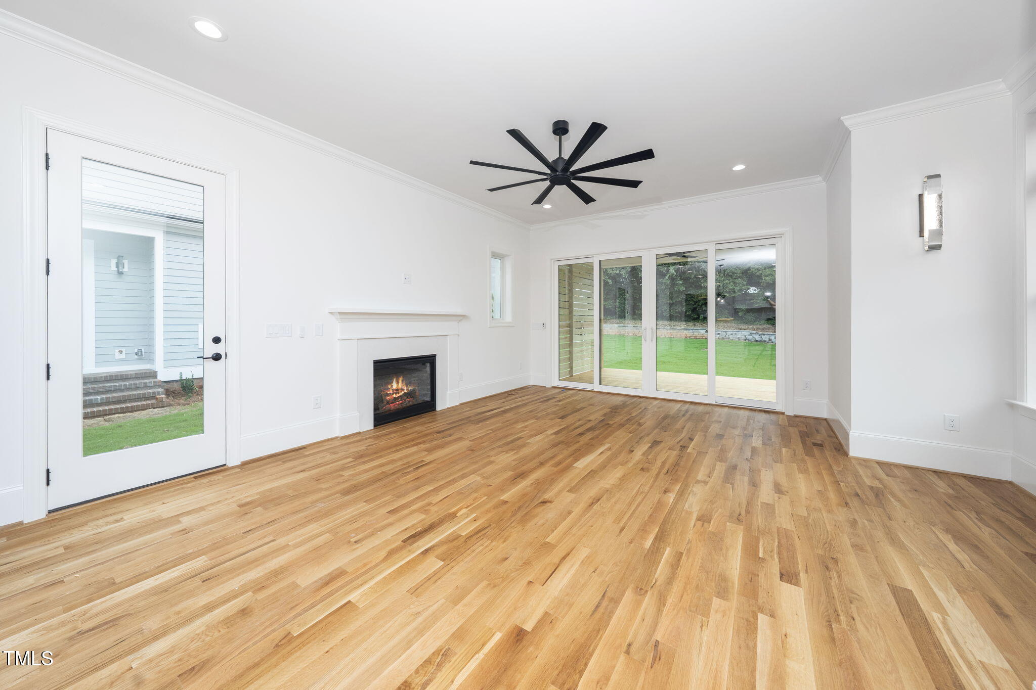 1330 Duplin Road Raleigh, NC 27607 - Photo 25 of 53 a view of empty room with wooden floor and fan