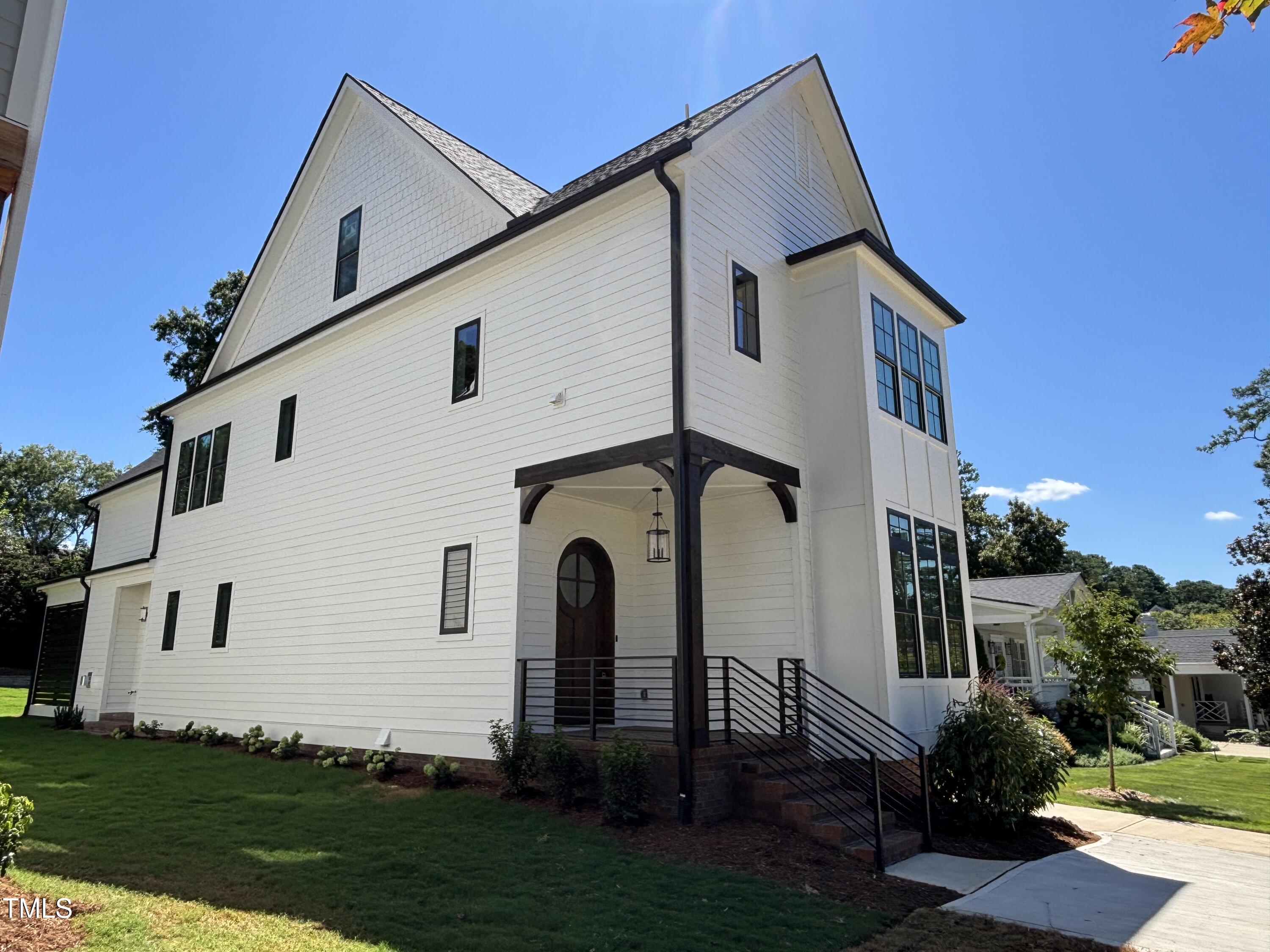 1330 Duplin Road Raleigh, NC 27607 - Photo 3 of 53 a front view of a house with a garden