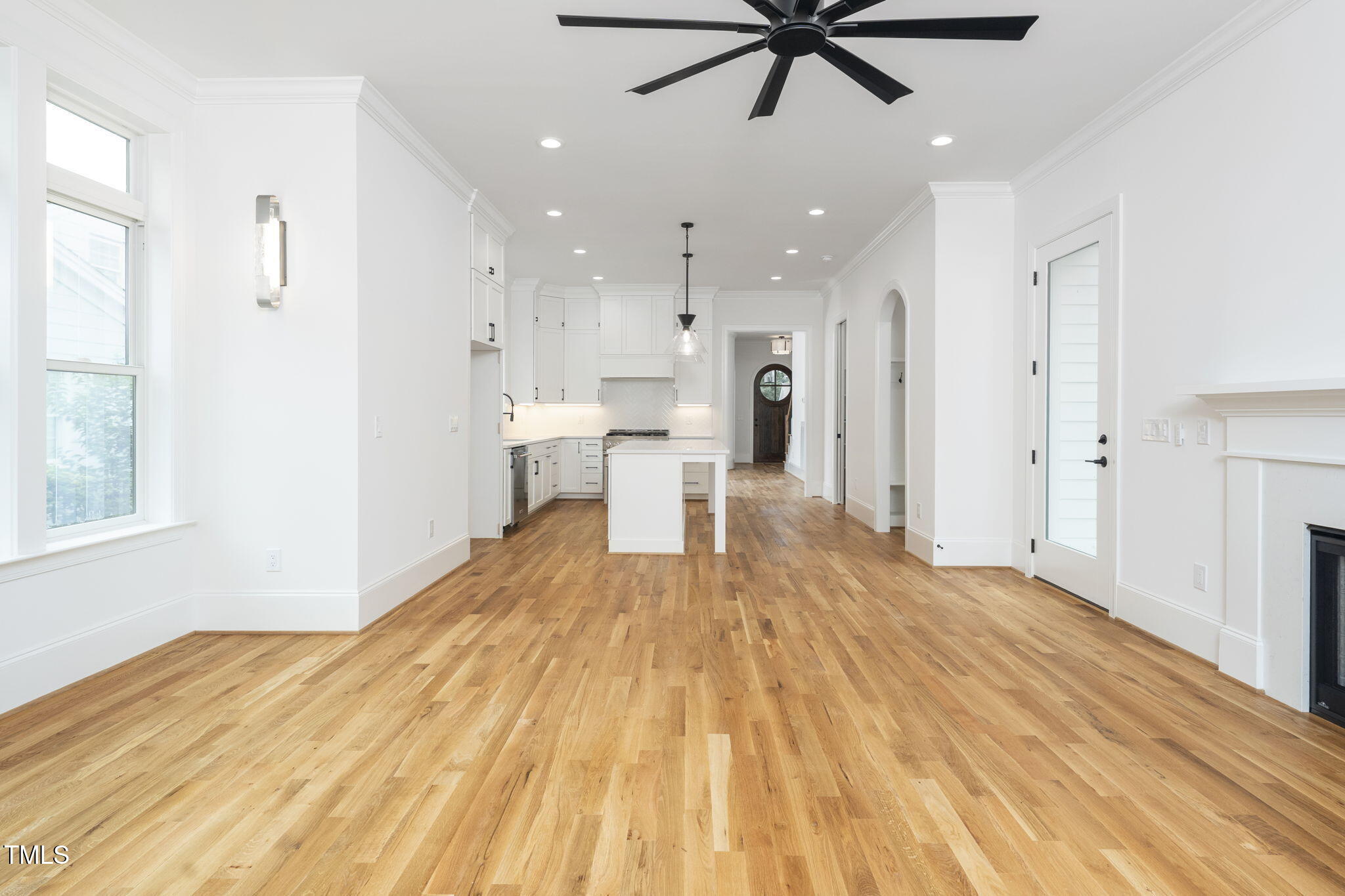 1330 Duplin Road Raleigh, NC 27607 - Photo 31 of 53 a view of a kitchen with wooden floor and a ceiling fan