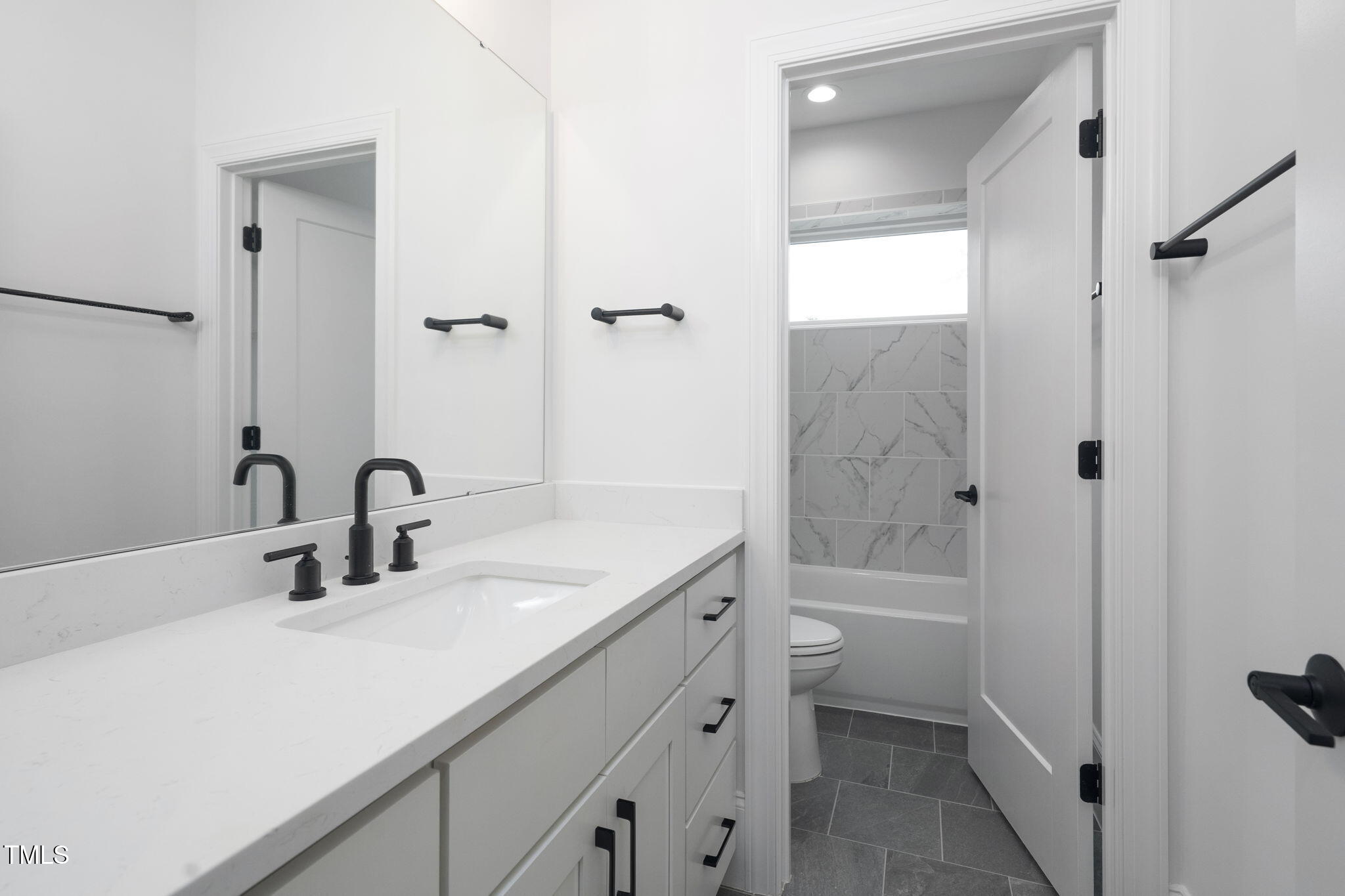1330 Duplin Road Raleigh, NC 27607 - Photo 34 of 53 a bathroom with a granite countertop sink a toilet and shower