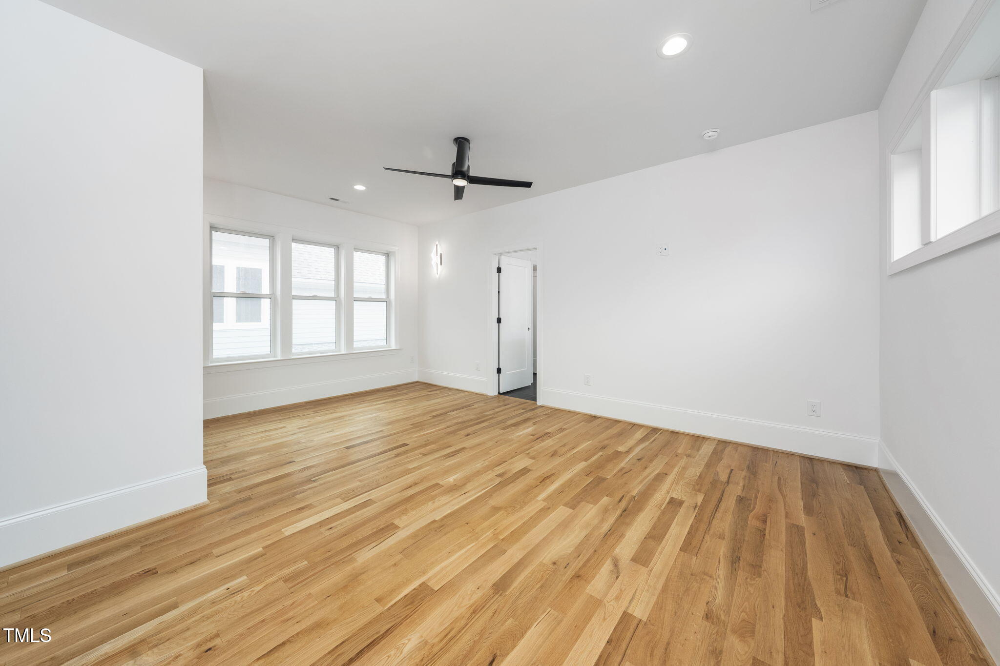 1330 Duplin Road Raleigh, NC 27607 - Photo 37 of 53 an empty room with wooden floor and windows