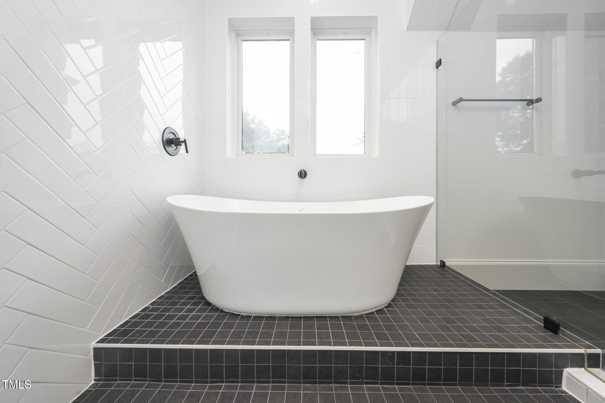 1330 Duplin Road Raleigh, NC 27607 - Photo 40 of 53 a white bath tub sitting in a bathroom