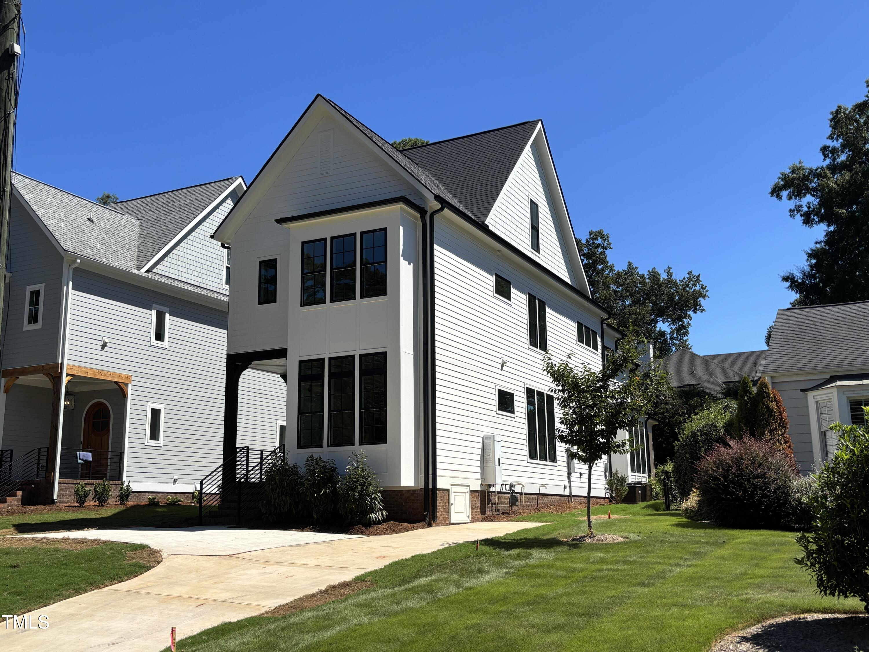 1330 Duplin Road Raleigh, NC 27607 - Photo 4 of 53 a front view of a house with a yard