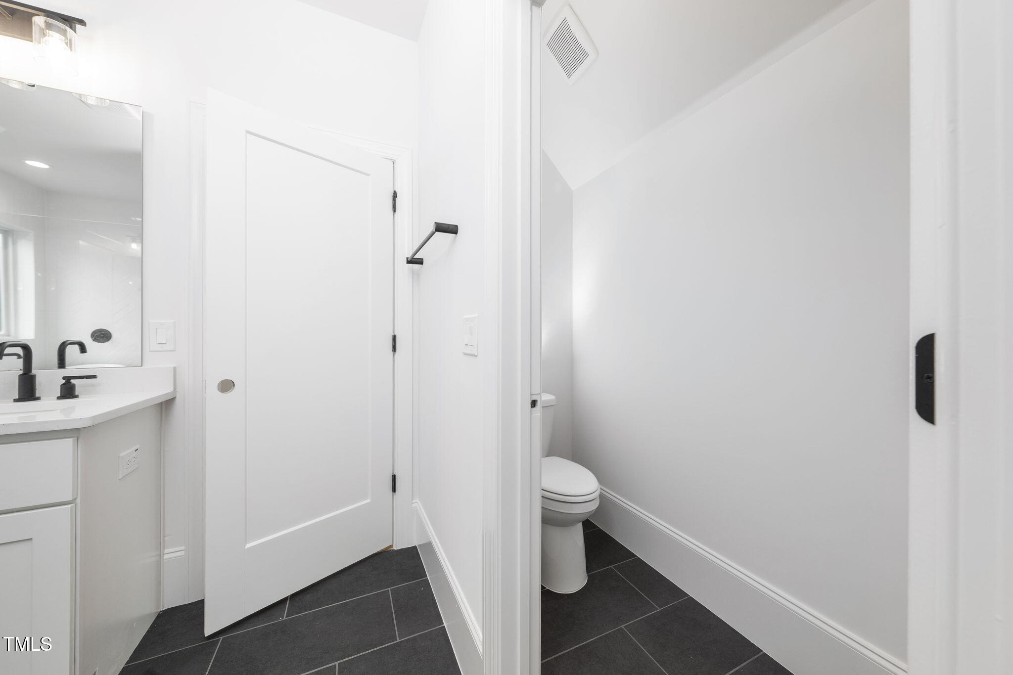 1330 Duplin Road Raleigh, NC 27607 - Photo 41 of 53 a bathroom with a sink and a mirror