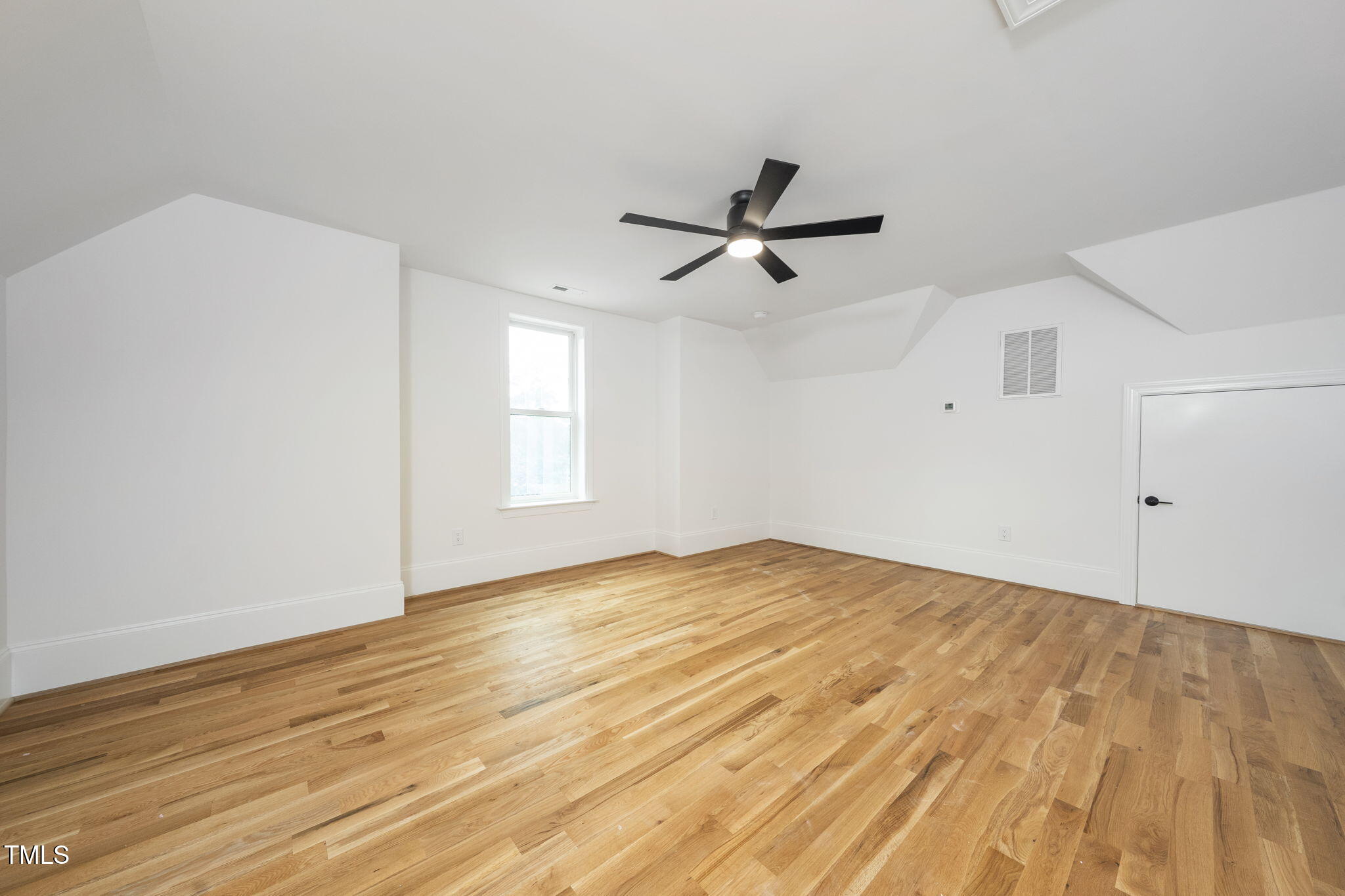 1330 Duplin Road Raleigh, NC 27607 - Photo 45 of 53 a view of empty room with wooden floor and fan