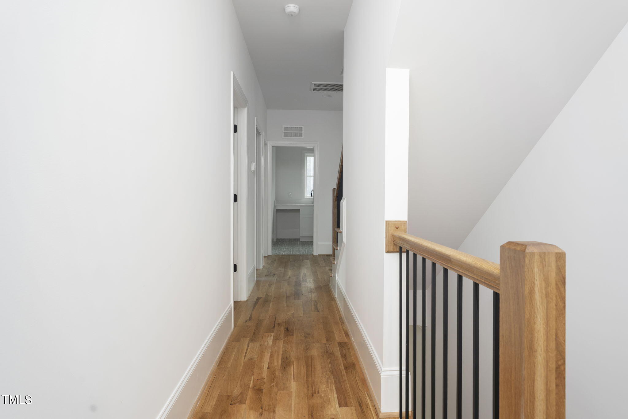 1330 Duplin Road Raleigh, NC 27607 - Photo 48 of 53 a view of a hallway with wooden floor