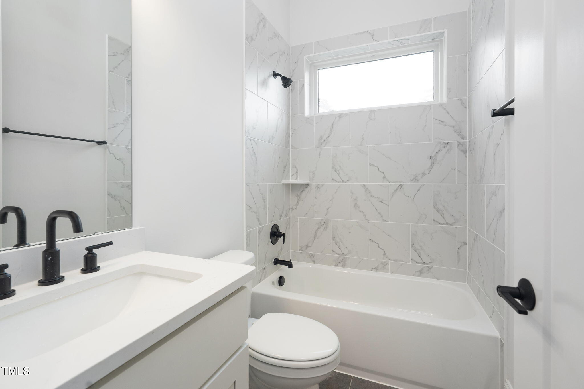 1330 Duplin Road Raleigh, NC 27607 - Photo 49 of 53 a bathroom with a sink a toilet and a bathtub