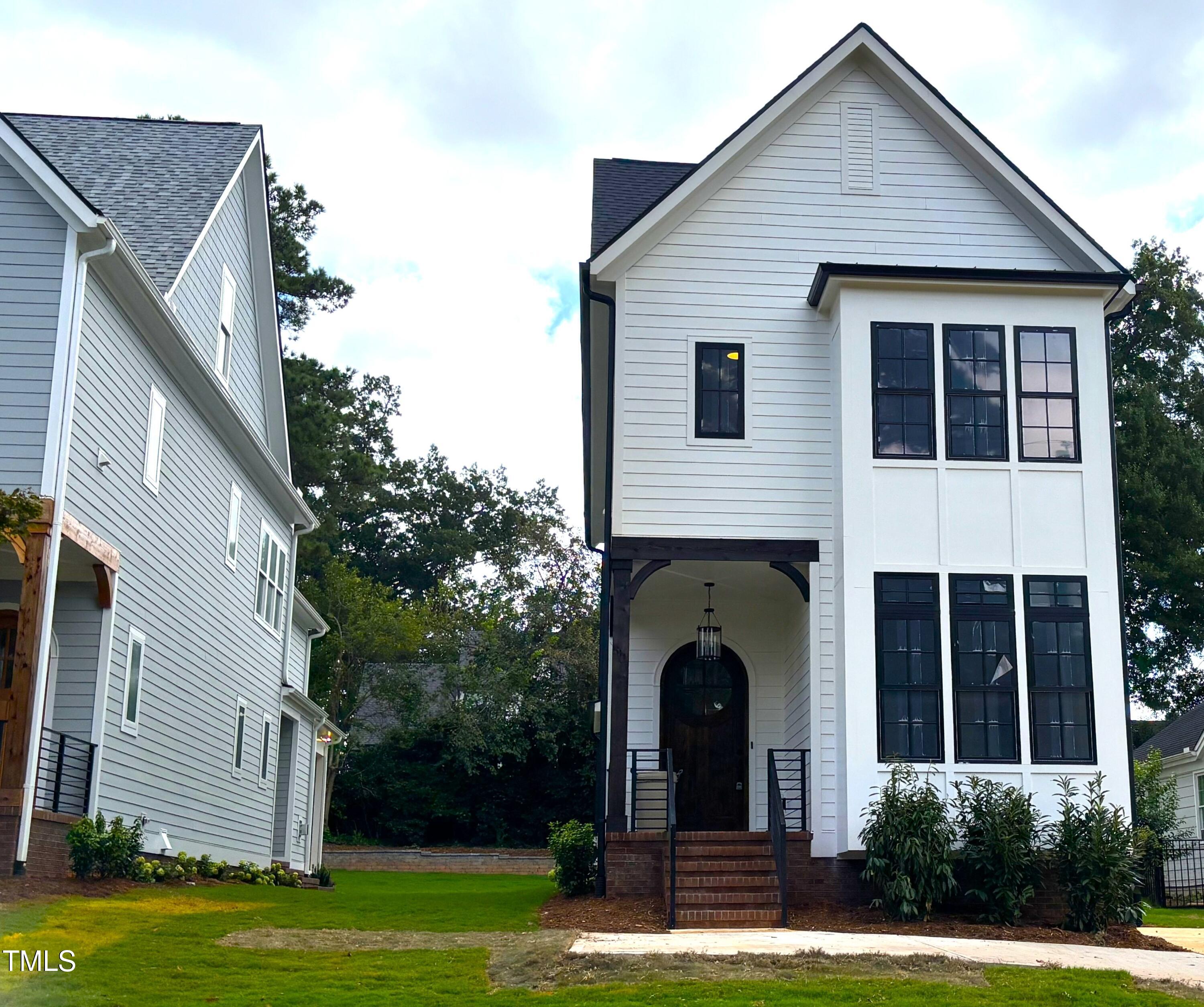 1330 Duplin Road Raleigh, NC 27607 - Photo 7 of 53 a front view of a house with garden