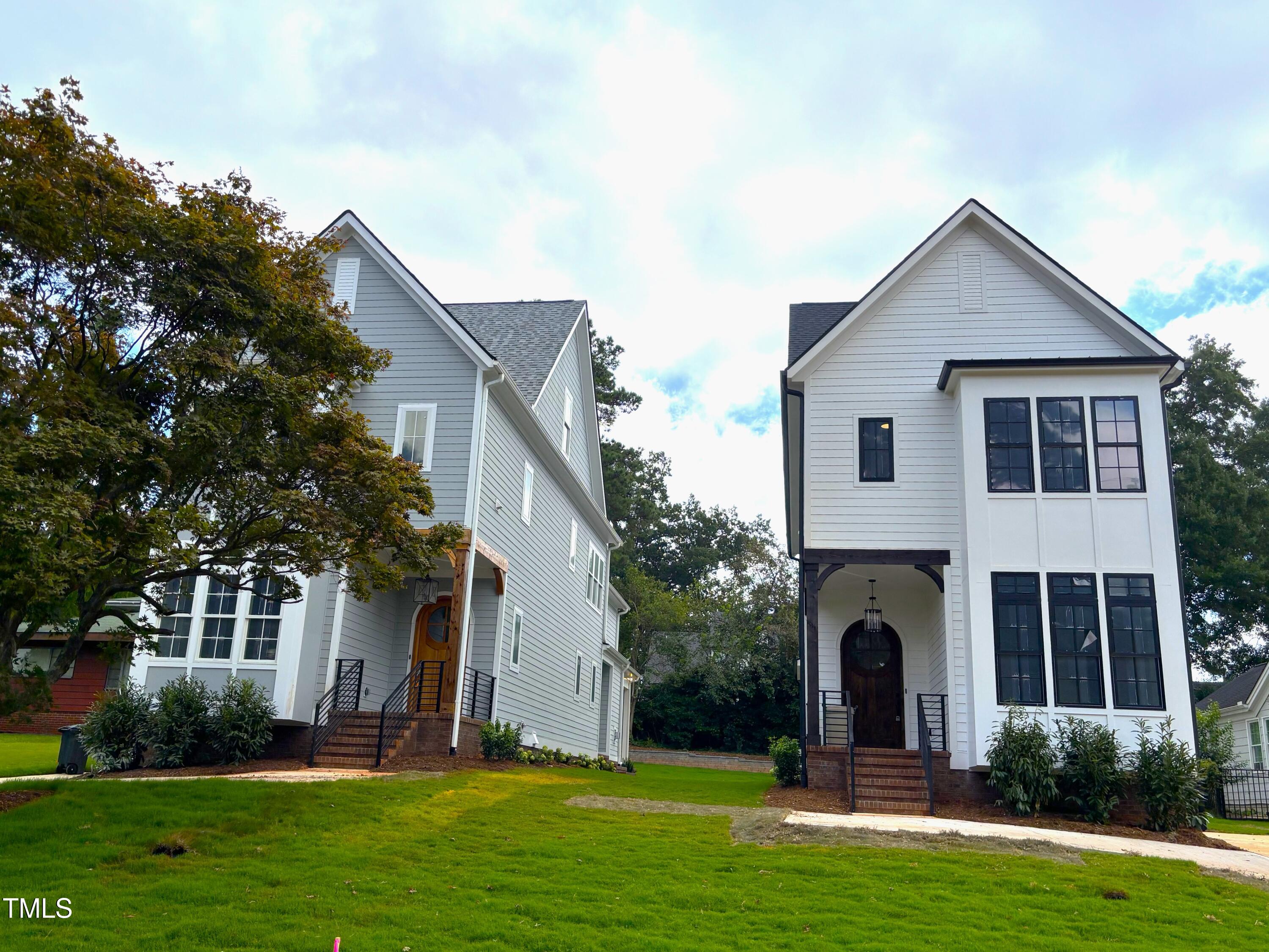 1330 Duplin Road Raleigh, NC 27607 - Photo 8 of 53 a front view of a house with a yard and garage