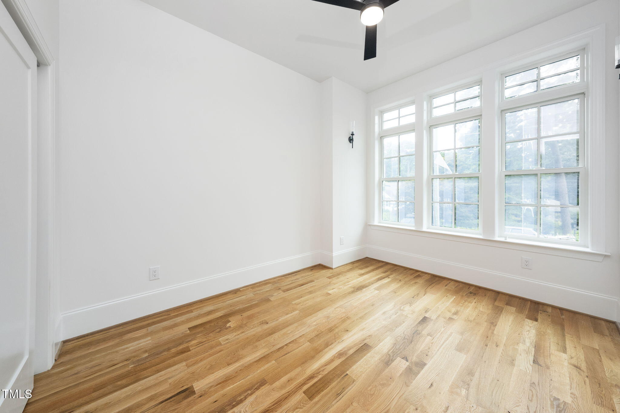 1330 Duplin Road Raleigh, NC 27607 - Photo 10 of 53 wooden floor in an empty room with a window