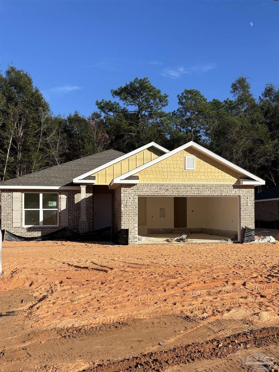 a view of house with yard