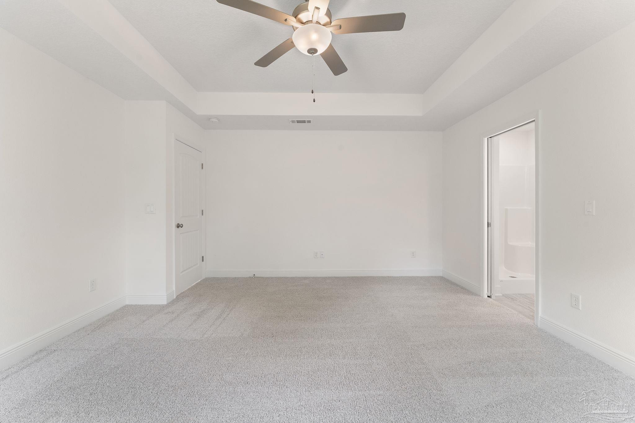 4930 East Spencer Field Road Pace, FL 32571 - Photo 13 of 28 an empty room with chandelier fan