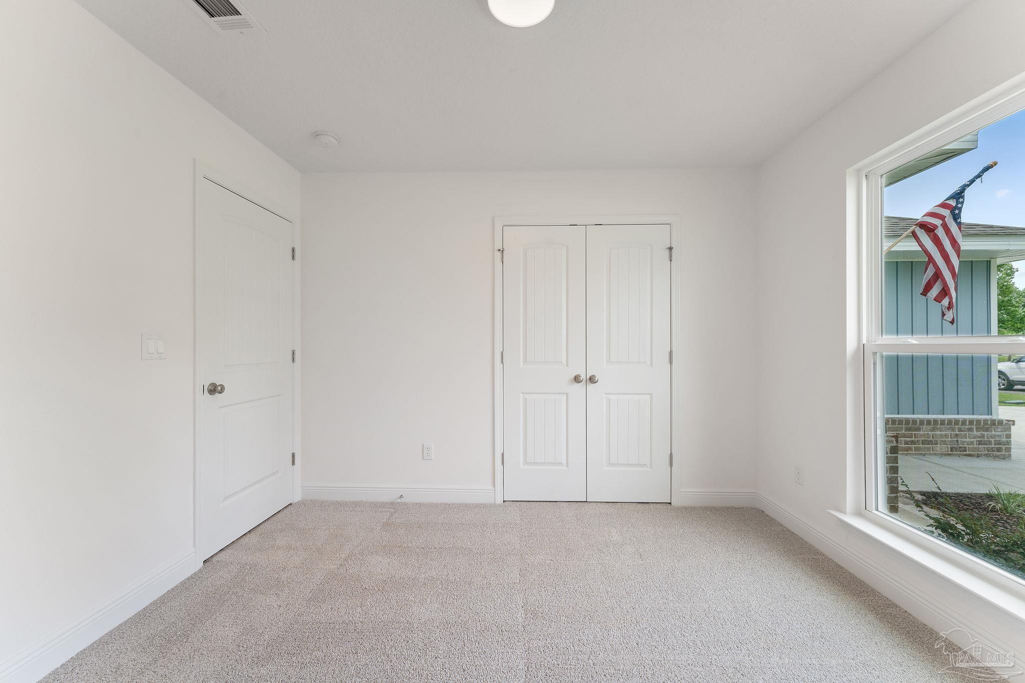 4930 East Spencer Field Road Pace, FL 32571 - Photo 15 of 28 an empty room with shelves