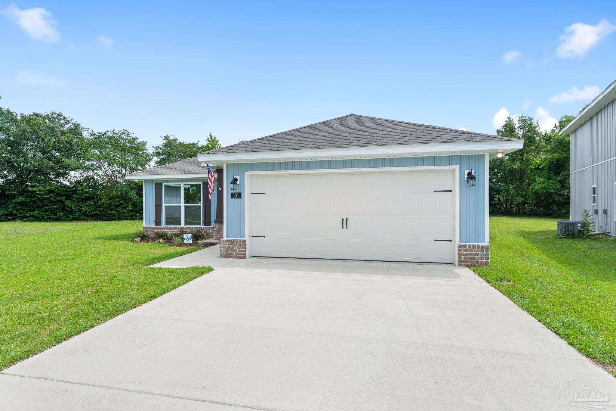 4930 East Spencer Field Road Pace, FL 32571 - Photo 2 of 28 a front view of house with yard and green space