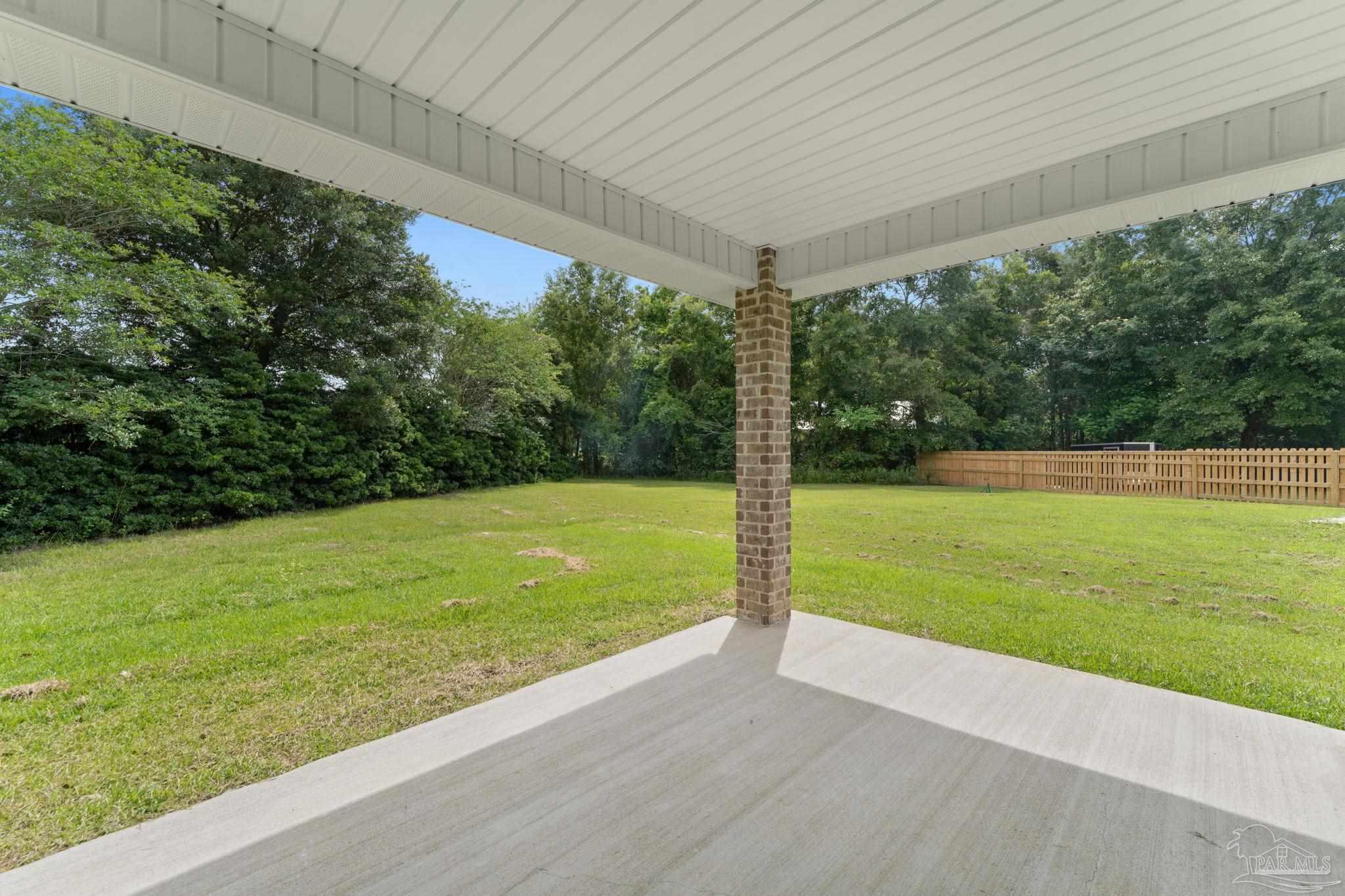 4930 East Spencer Field Road Pace, FL 32571 - Photo 23 of 28 a view of a yard with a large trees