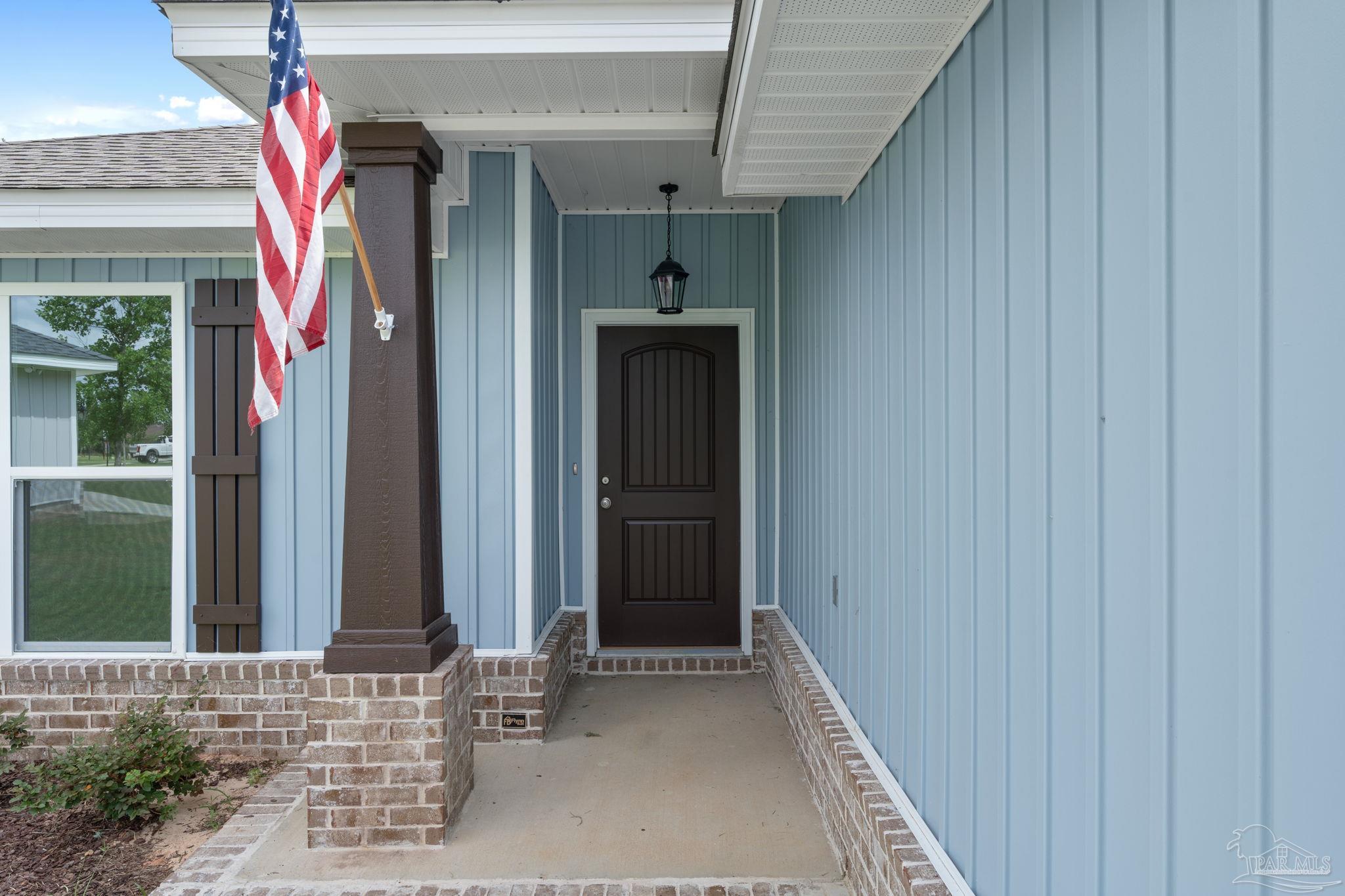 4930 East Spencer Field Road Pace, FL 32571 - Photo 3 of 28 a view of a entryway door of the house