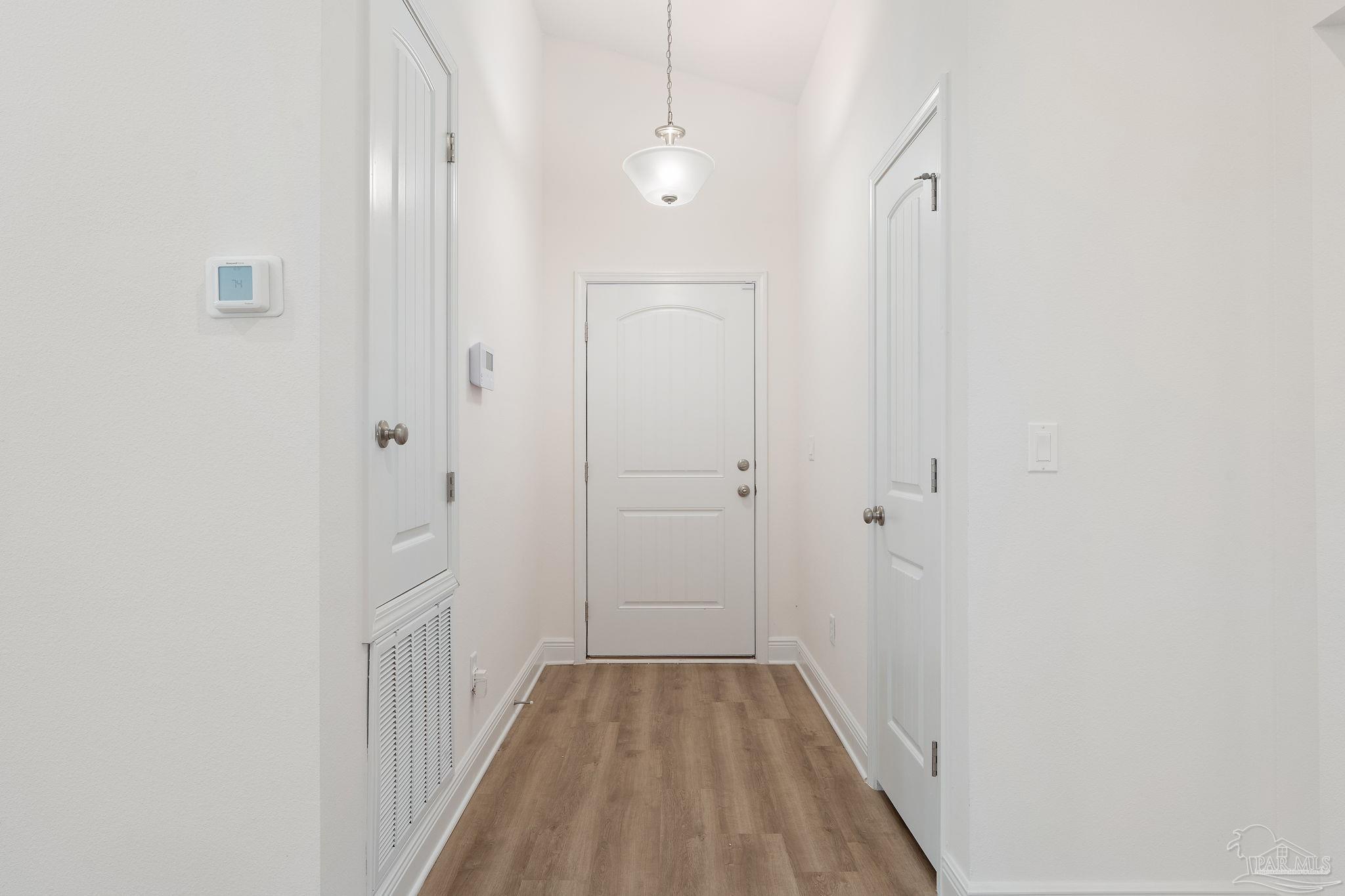 4930 East Spencer Field Road Pace, FL 32571 - Photo 4 of 28 a view of a room with wooden floor