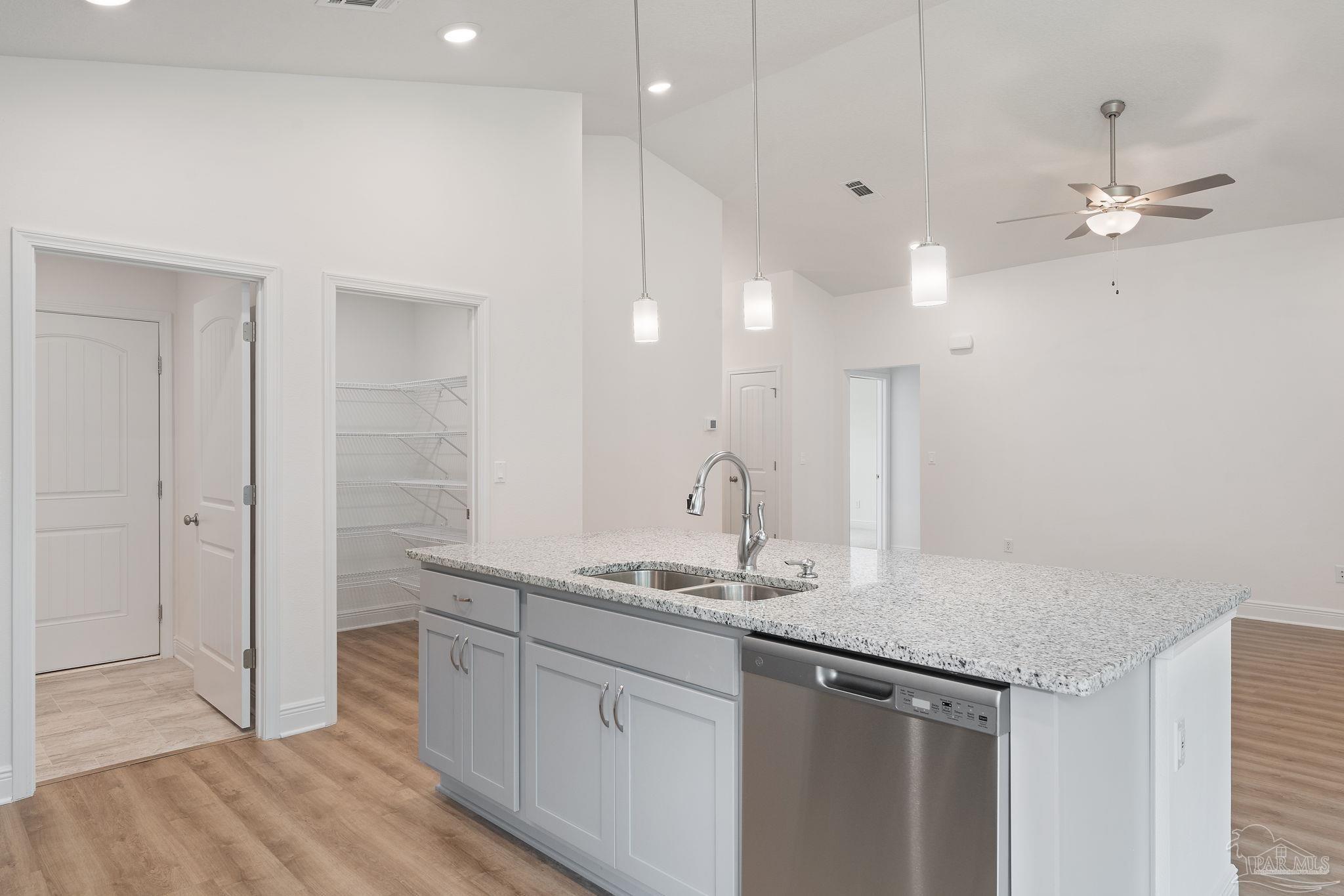4930 East Spencer Field Road Pace, FL 32571 - Photo 8 of 28 a bathroom with a granite countertop sink a mirror and shower