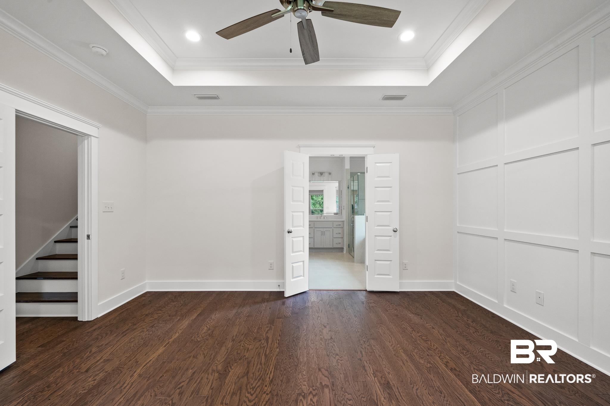 29 Signal Hill Road Daphne, AL 36527 - Photo 20 of 36 Unfurnished bedroom featuring crown molding, a raised ceiling, and dark hardwood / wood-style floors