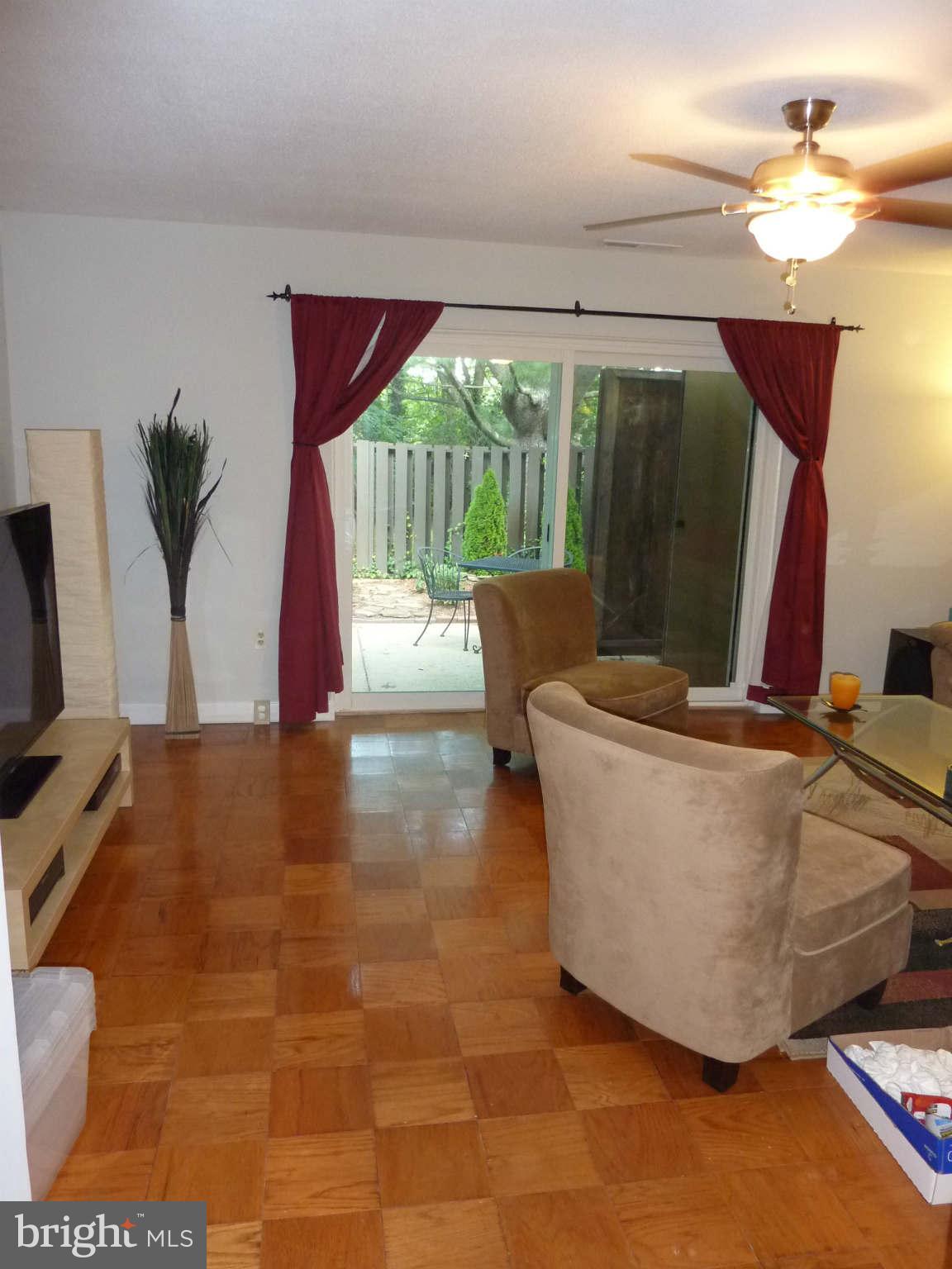 1304 Northgate Square Reston, VA 20190 - Photo 4 of 23 Living Room with SGD to patio and yard