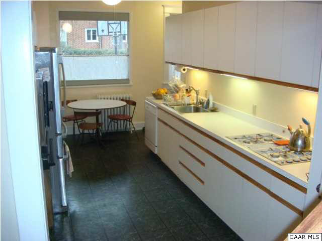 1934 Lewis Mountain Road Charlottesville, VA 22903 - Photo 10 of 32 Good prep space in this galley kitchen and breakfast nook. Access a side patio and back yard from here.