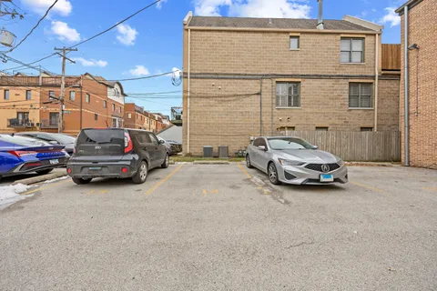 a view of a car parked in front of a building