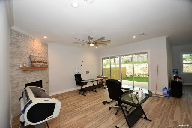 a work room with furniture and a fireplace