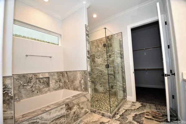 a bathroom with a bathtub and a shower