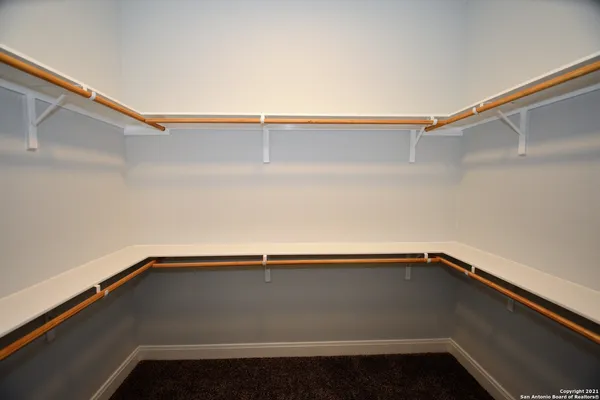 a bathroom with a sink mirror and a shower