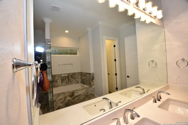 a kitchen with a sink a stove and cabinets