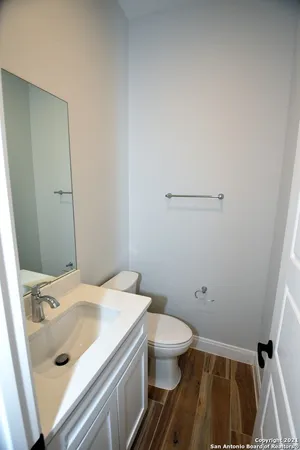 an empty room with a window and ceiling fan