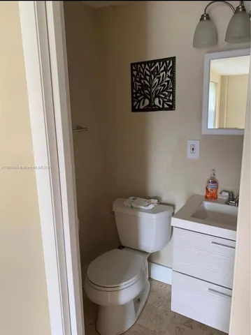 a bathroom with a toilet and a sink