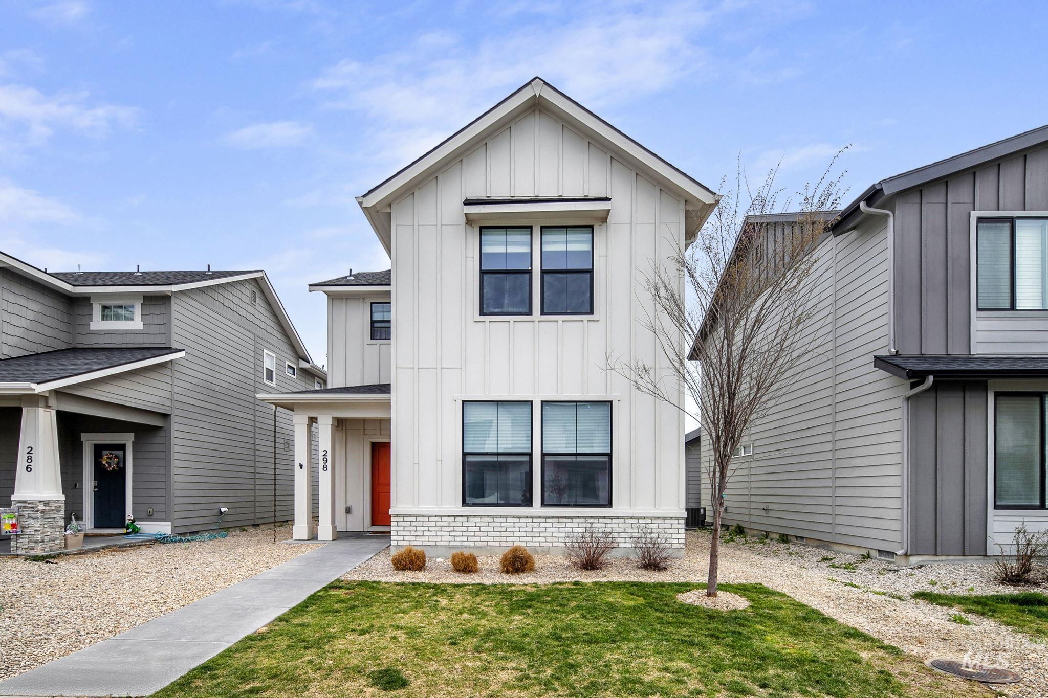 298 South Fritts Avenue Meridian, ID 83642 - Photo 1 of 32 Modern farmhouse featuring board and batten siding, a front yard, and roof with shingles
