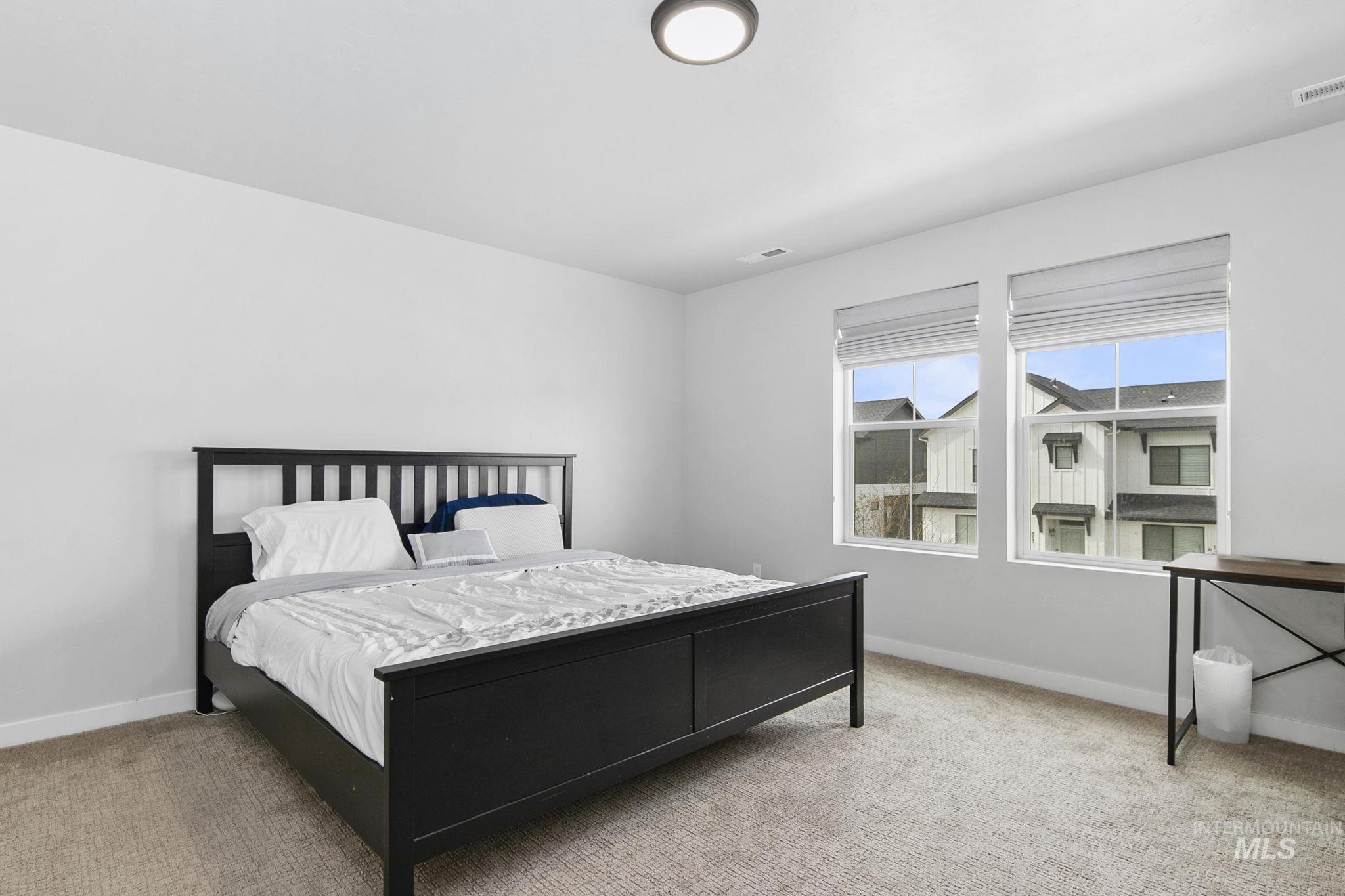 298 South Fritts Avenue Meridian, ID 83642 - Photo 16 of 32 Carpeted bedroom with baseboards