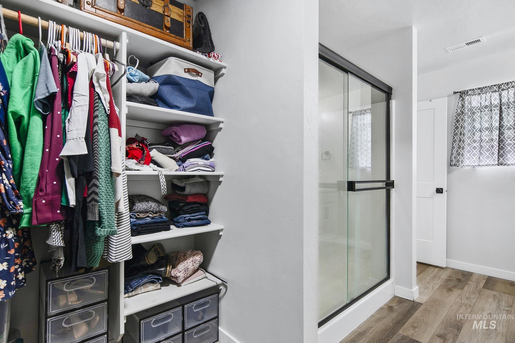 298 South Fritts Avenue Meridian, ID 83642 - Photo 20 of 32 Full bath with a shower stall and wood finished floors