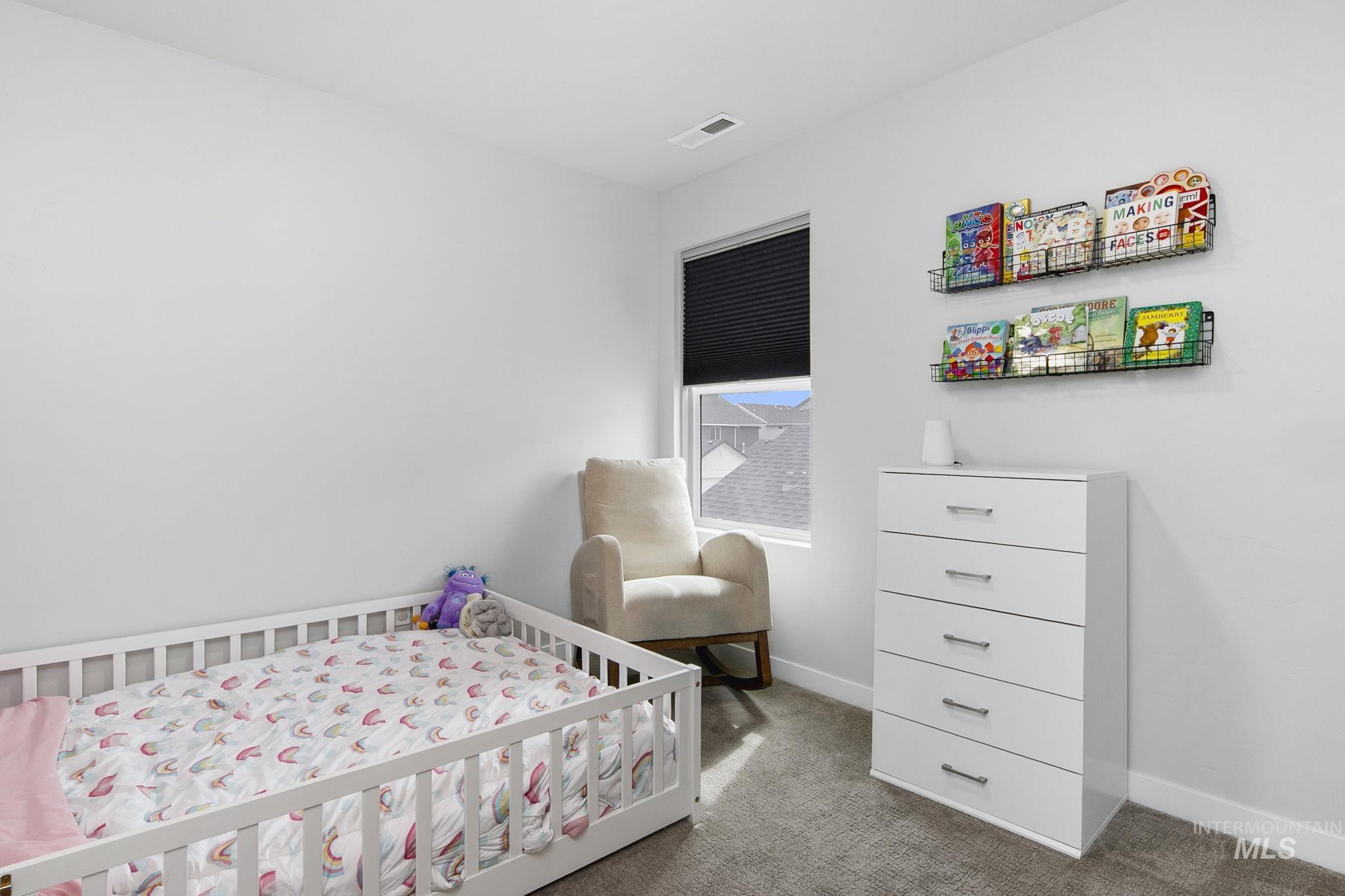 298 South Fritts Avenue Meridian, ID 83642 - Photo 25 of 32 Bedroom with carpet and a crib